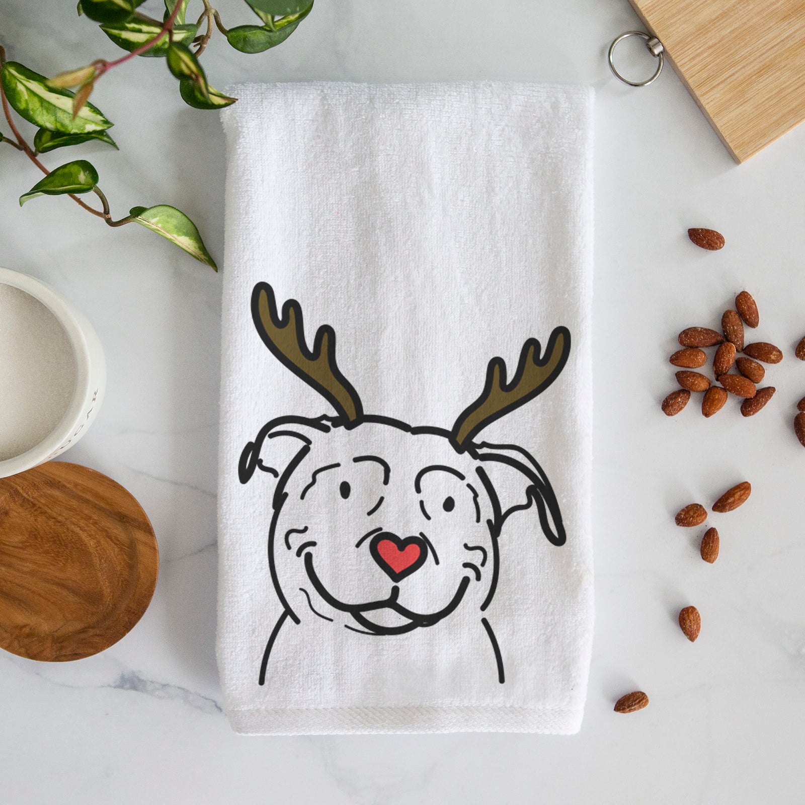 Minimalist line drawing of Lady the American Pitbull Terrier with reindeer antlers and a red nose on a decorative hand towel