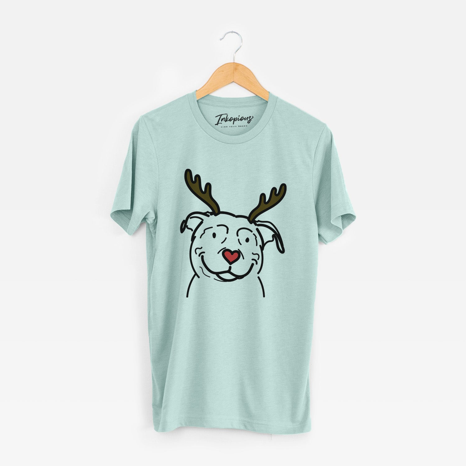 Minimalist line drawing of Lady the American Pitbull Terrier with reindeer antlers and a red nose on a Heather Sage Unisex crewneck