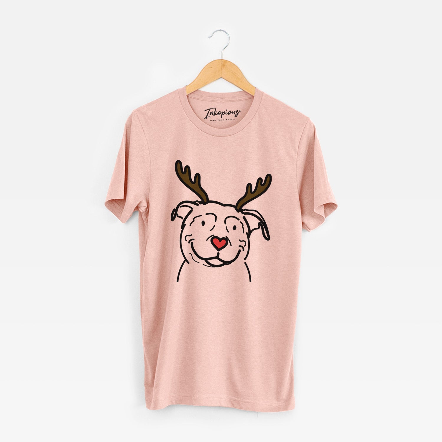 Minimalist line drawing of Lady the American Pitbull Terrier with reindeer antlers and a red nose on a Peach Unisex crewneck
