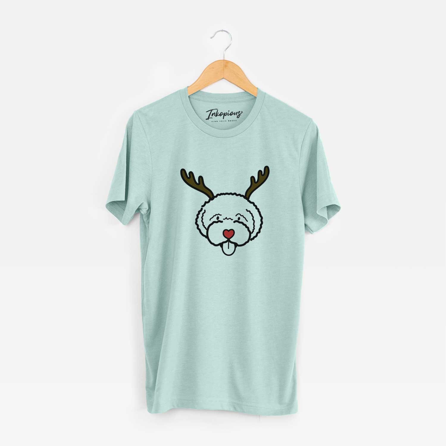 Minimalist line drawing of a Lagotta Romagnolo with reindeer antlers and a red nose on a Heather Sage Unisex crewneck