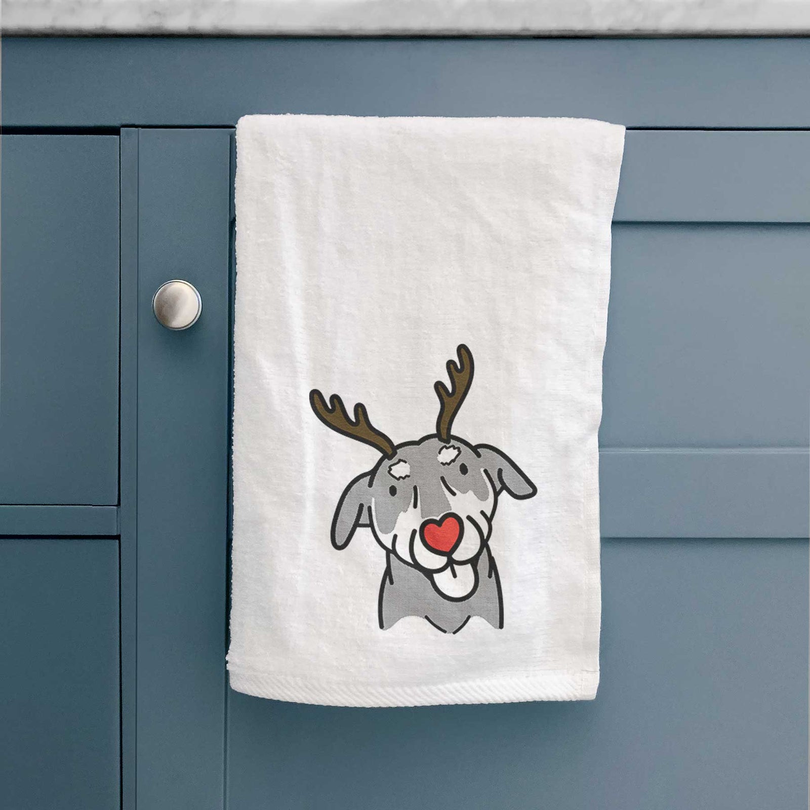 Minimalist line drawing of Lousia the Mixed Breed with reindeer antlers and a red nose on a decorative hand towel