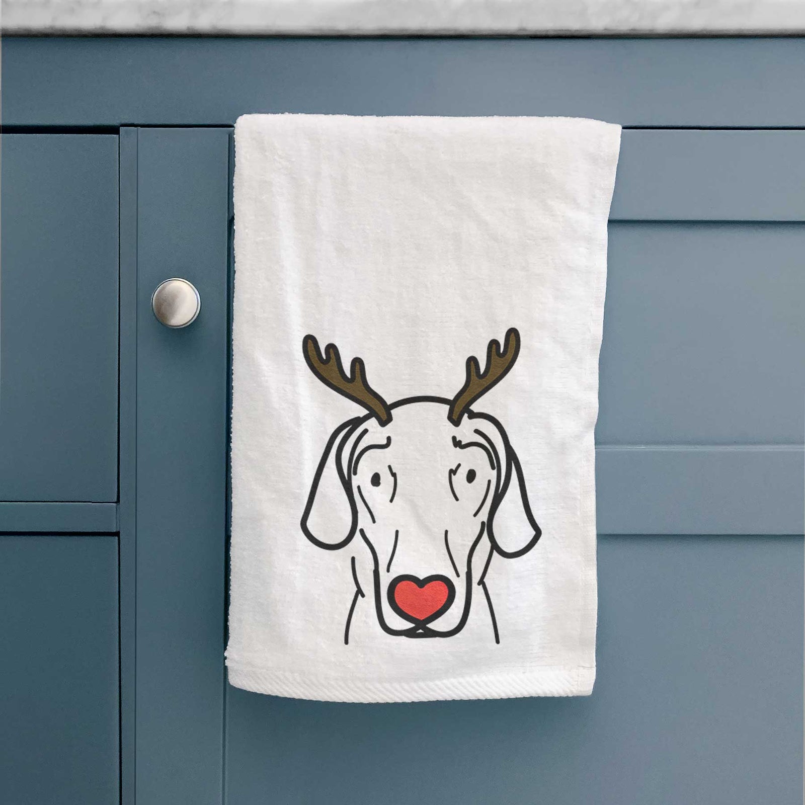Minimalist line drawing of Lucy the Great Dane with reindeer antlers and a red nose on a decorative hand towel