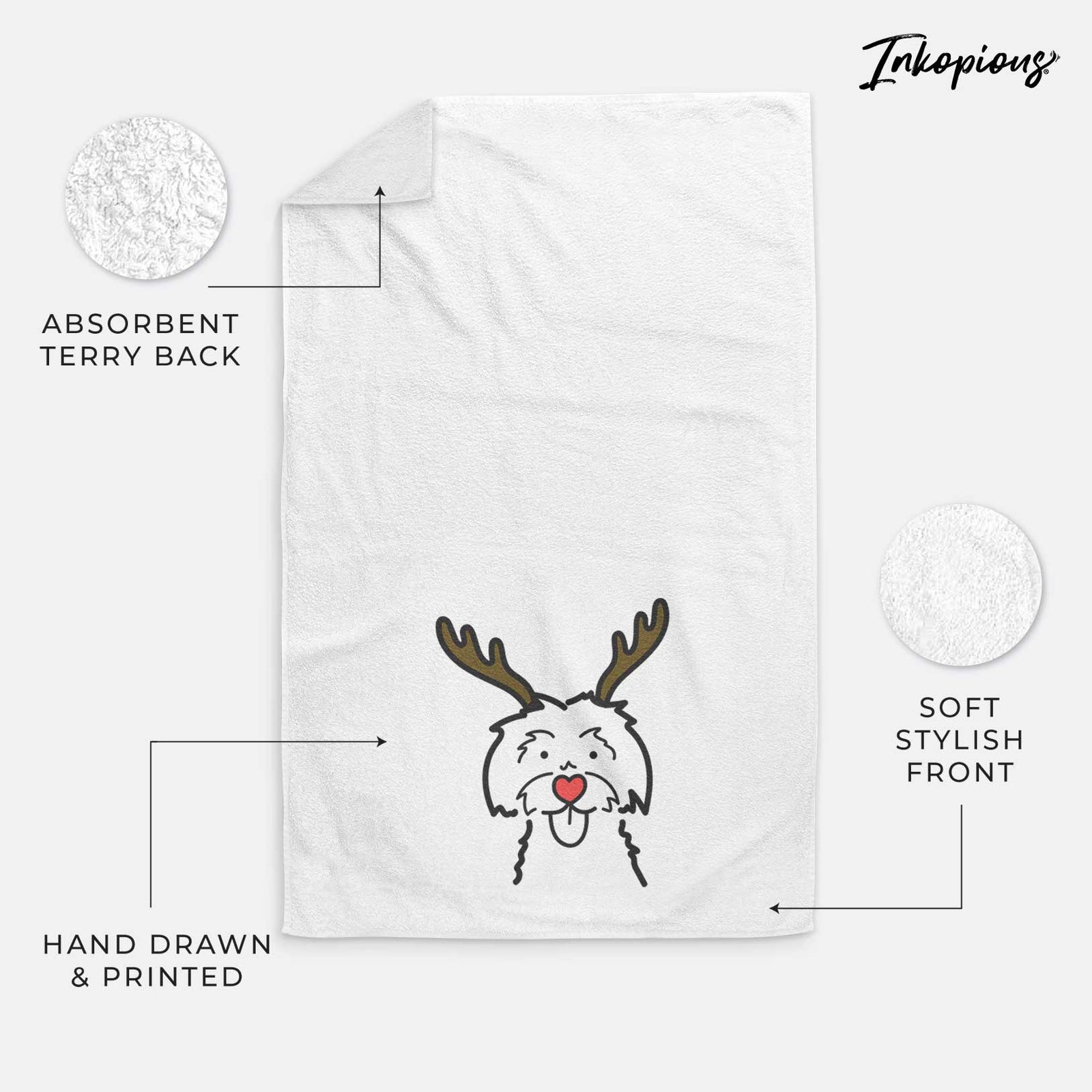 Minimalist line drawing of a Maltese with reindeer antlers and a red nose on a decorative hand towel