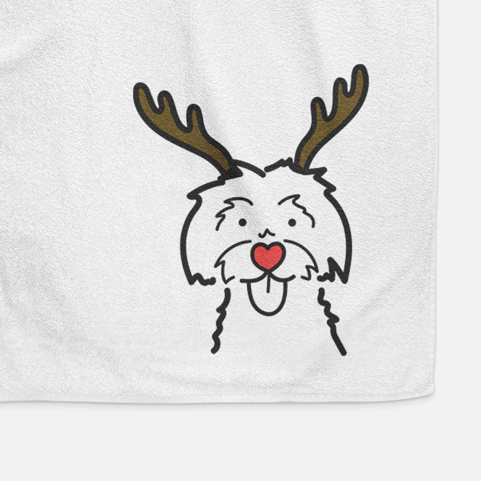 Minimalist line drawing of a Maltese with reindeer antlers and a red nose on a decorative hand towel