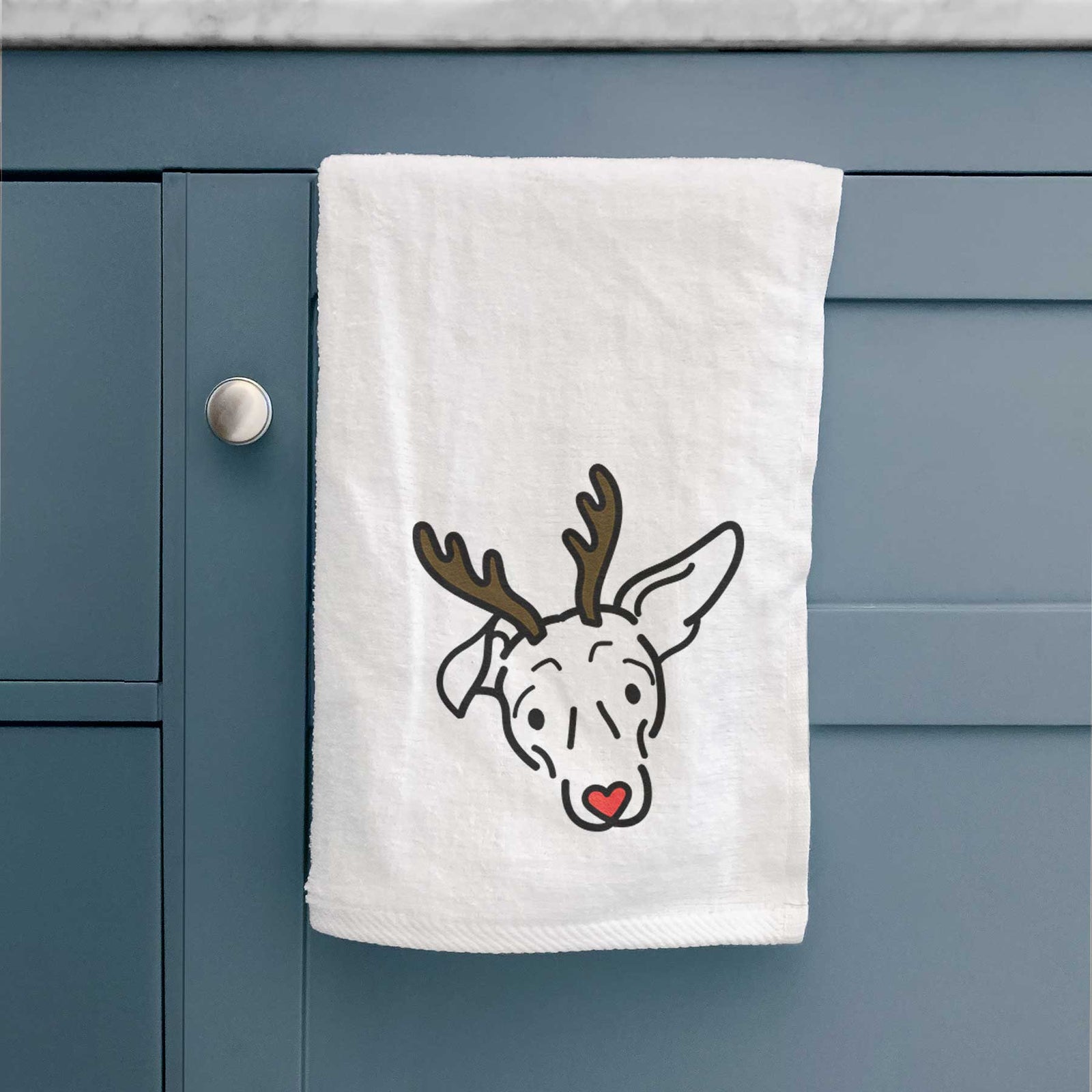 Minimalist line drawing of Millie the Mixed Breed with reindeer antlers and a red nose on a decorative hand towel