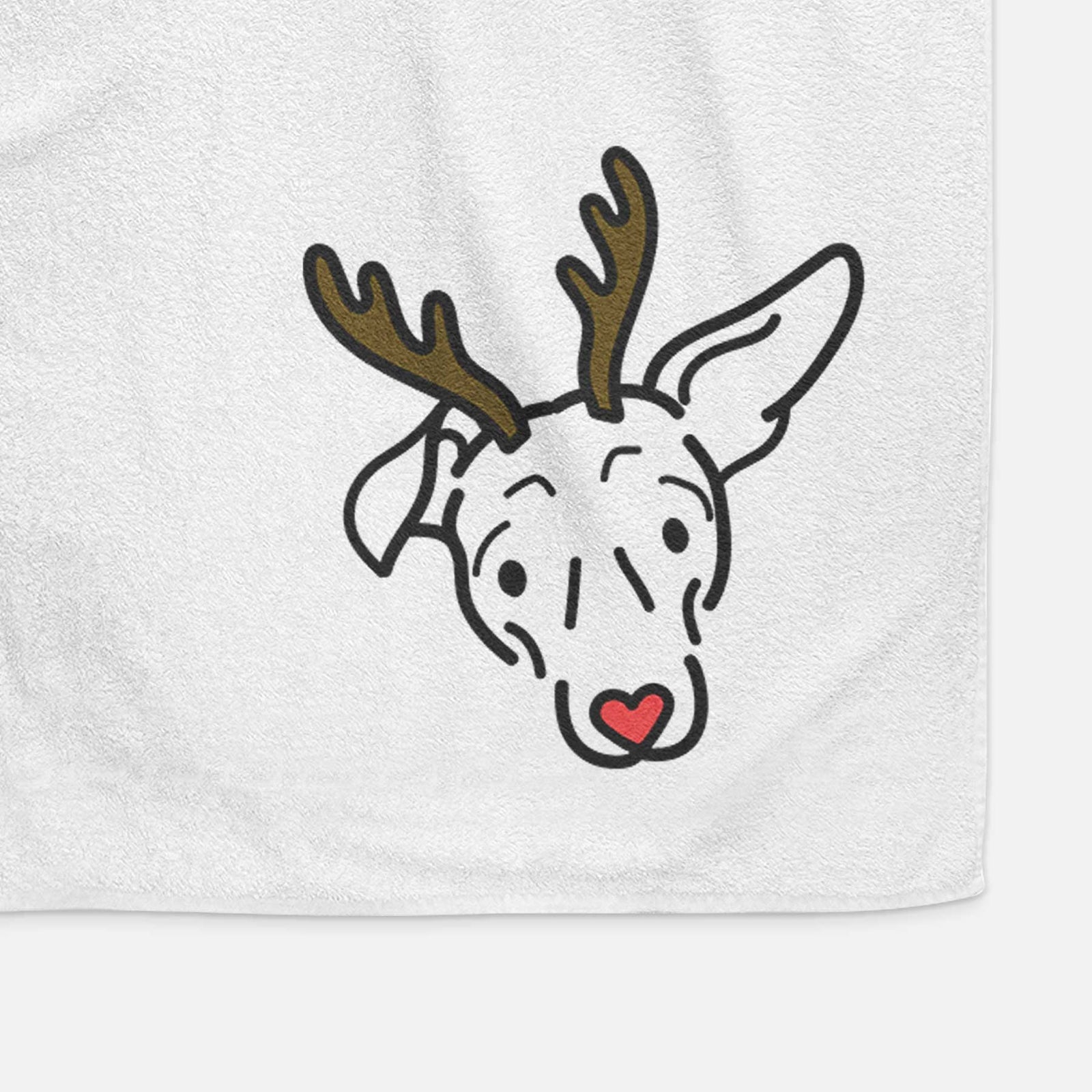 Minimalist line drawing of Millie the Mixed Breed with reindeer antlers and a red nose on a decorative hand towel