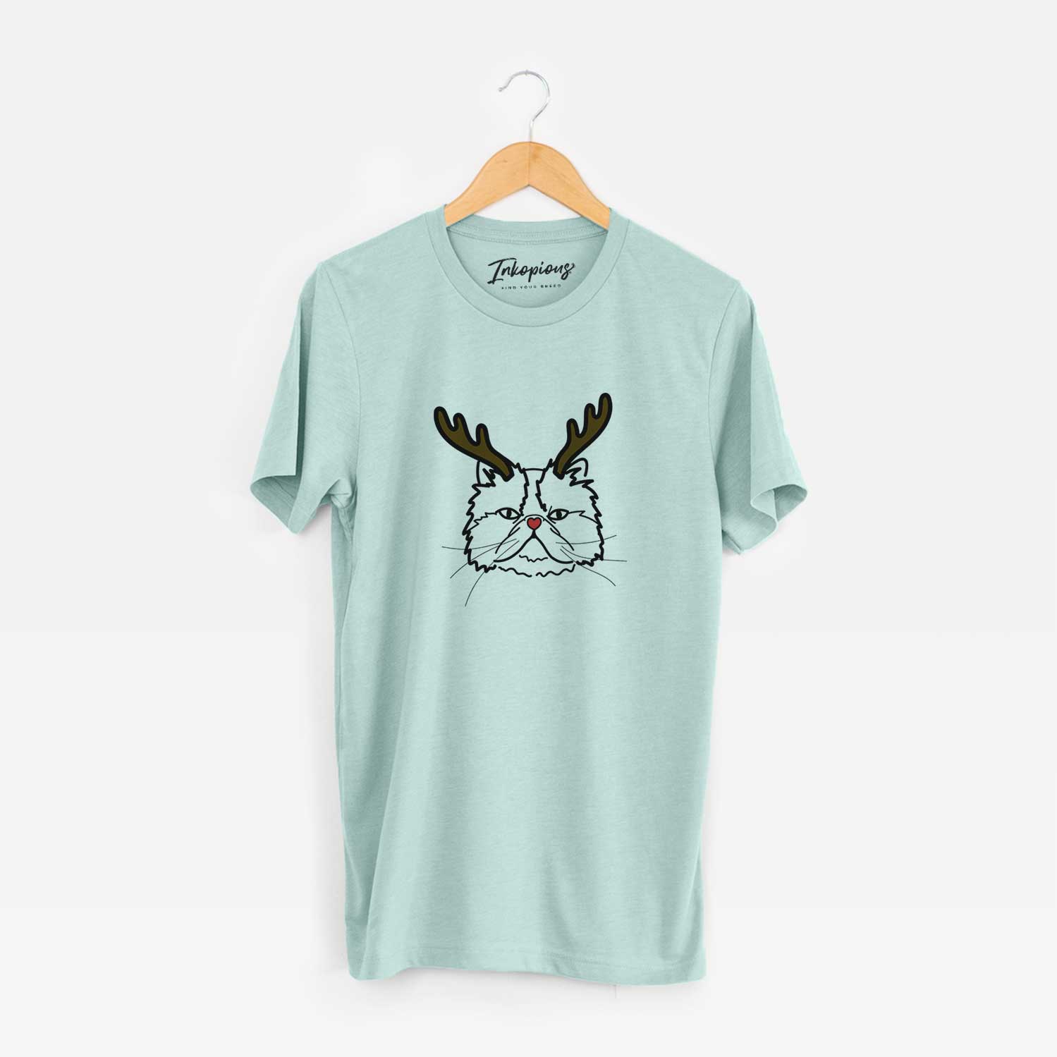 Minimalist line drawing of Mila the Persian Cat with reindeer antlers and a red nose on a Heather Sage Unisex crewneck