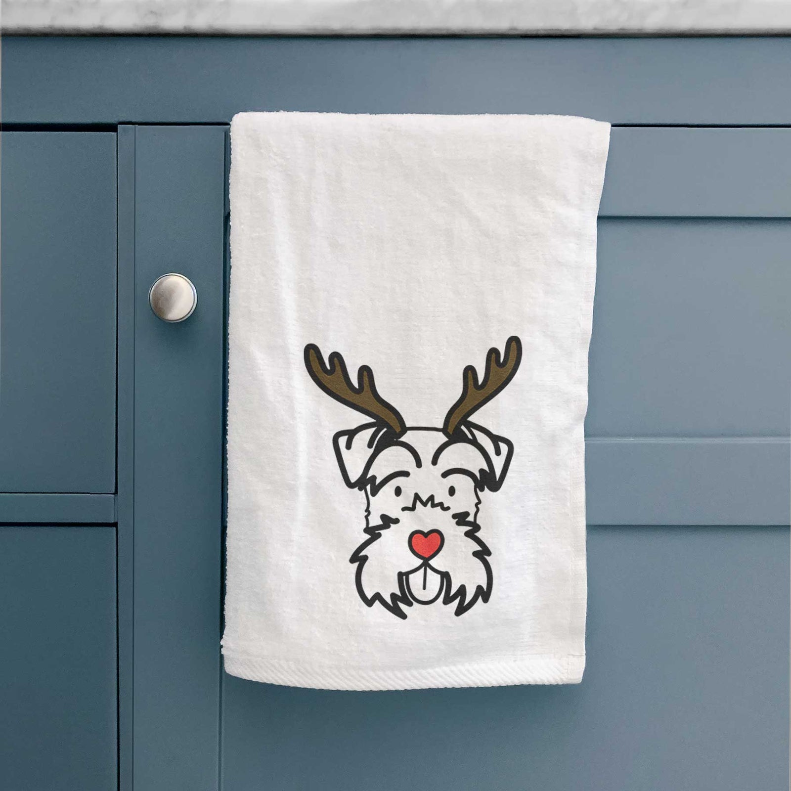 Minimalist line drawing of a Miniature Schnauzer with reindeer antlers and a red nose on a decorative hand towel