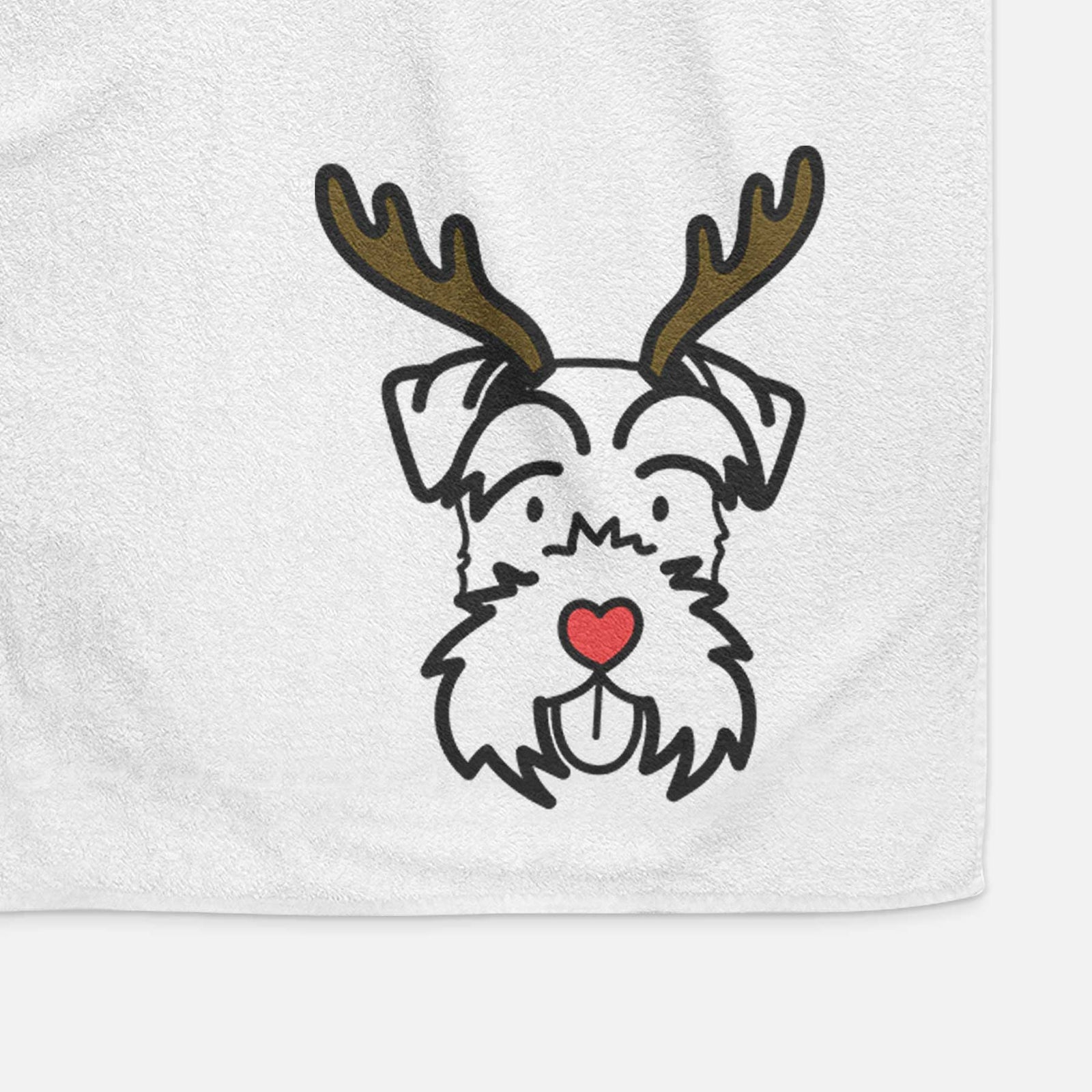 Minimalist line drawing of a Miniature Schnauzer with reindeer antlers and a red nose on a decorative hand towel
