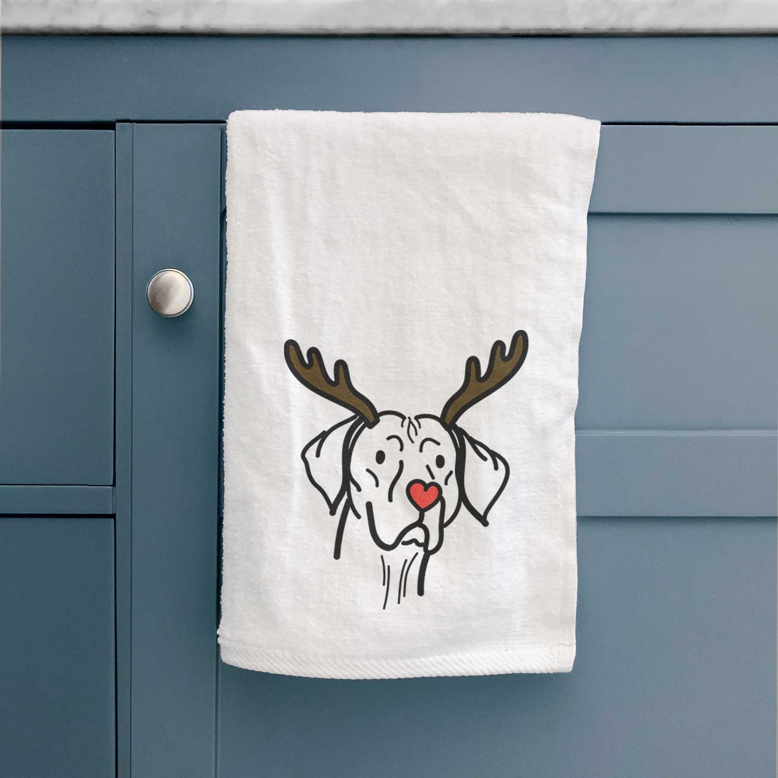Minimalist line drawing of Moose the Vizsla with reindeer antlers and a red nose on a decorative hand towel