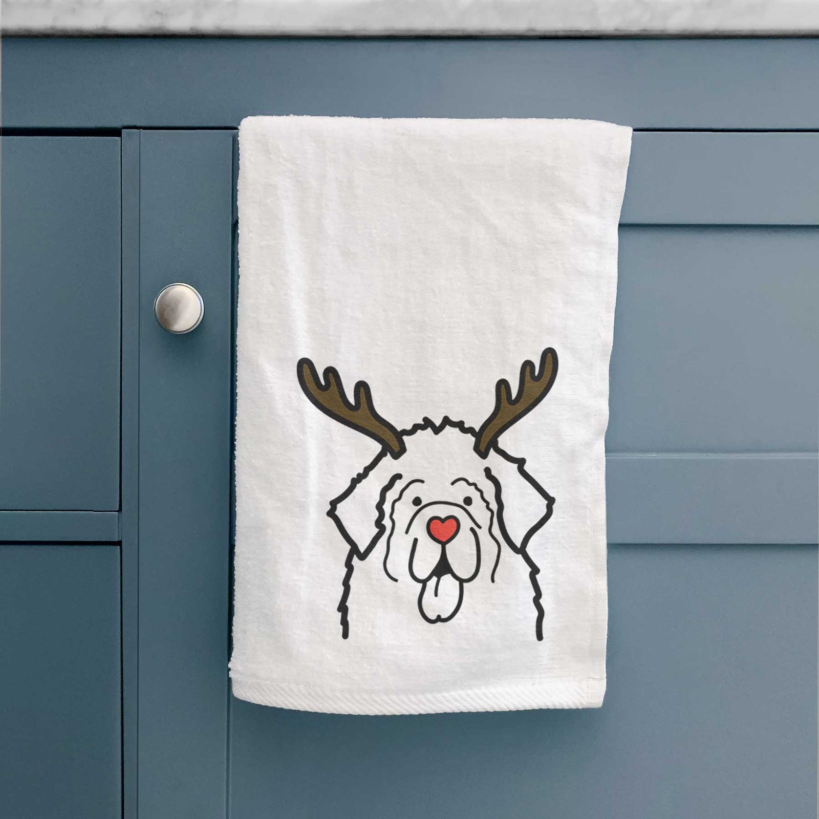 Minimalist line drawing of a Newfoundland with reindeer antlers and a red nose on a decorative hand towel