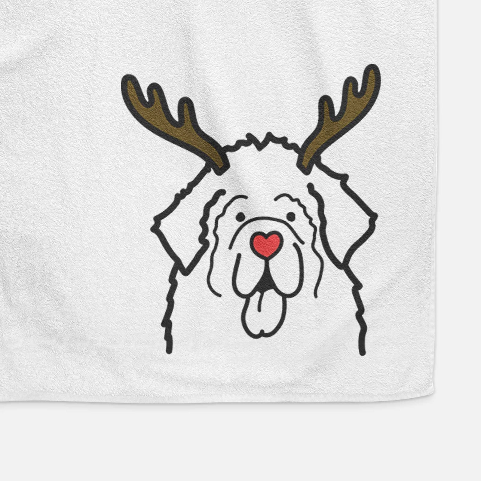 Minimalist line drawing of a Newfoundland with reindeer antlers and a red nose on a decorative hand towel