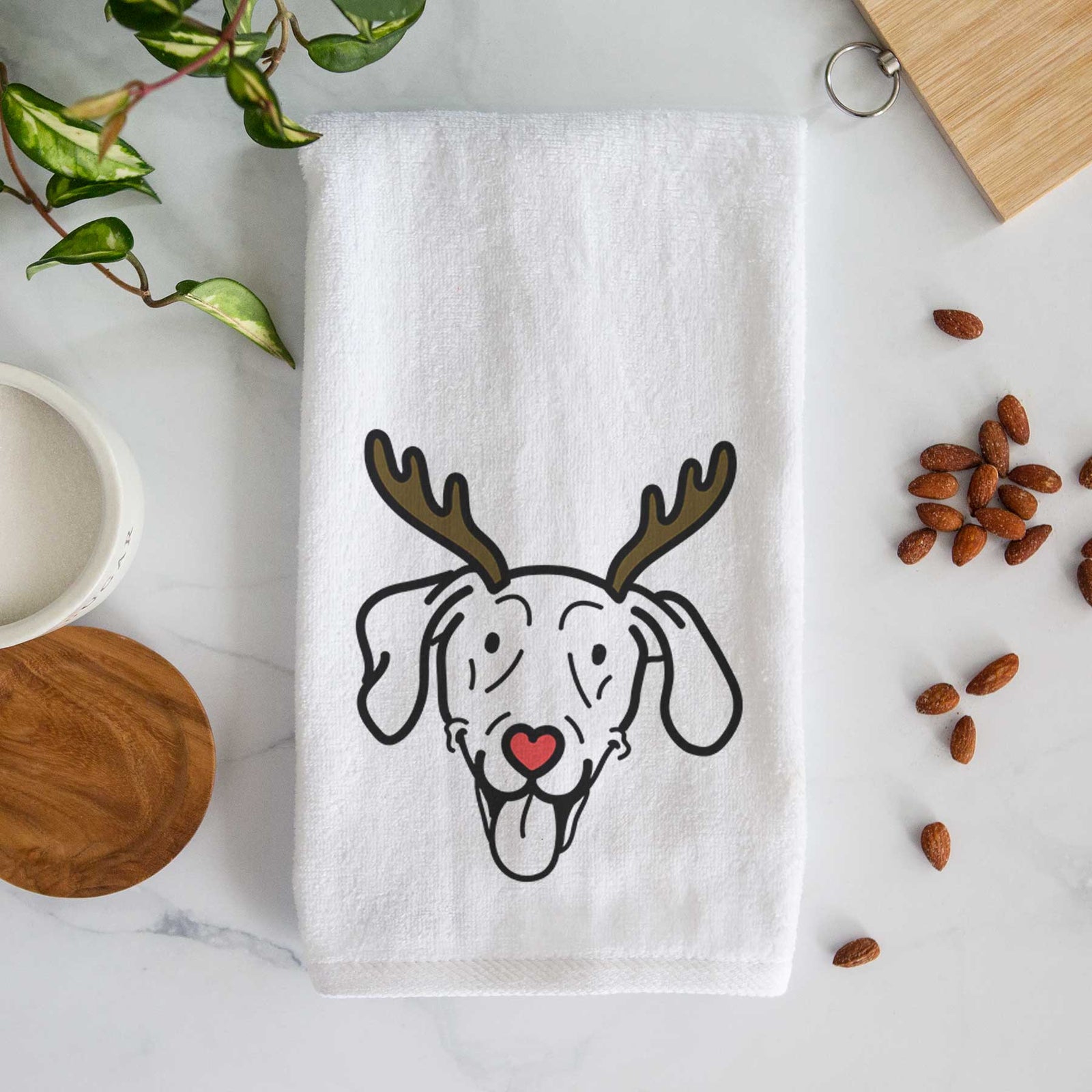 Minimalist line drawing of Paco Lobo the Weimaraner with reindeer antlers and a red nose on a decorative hand towel