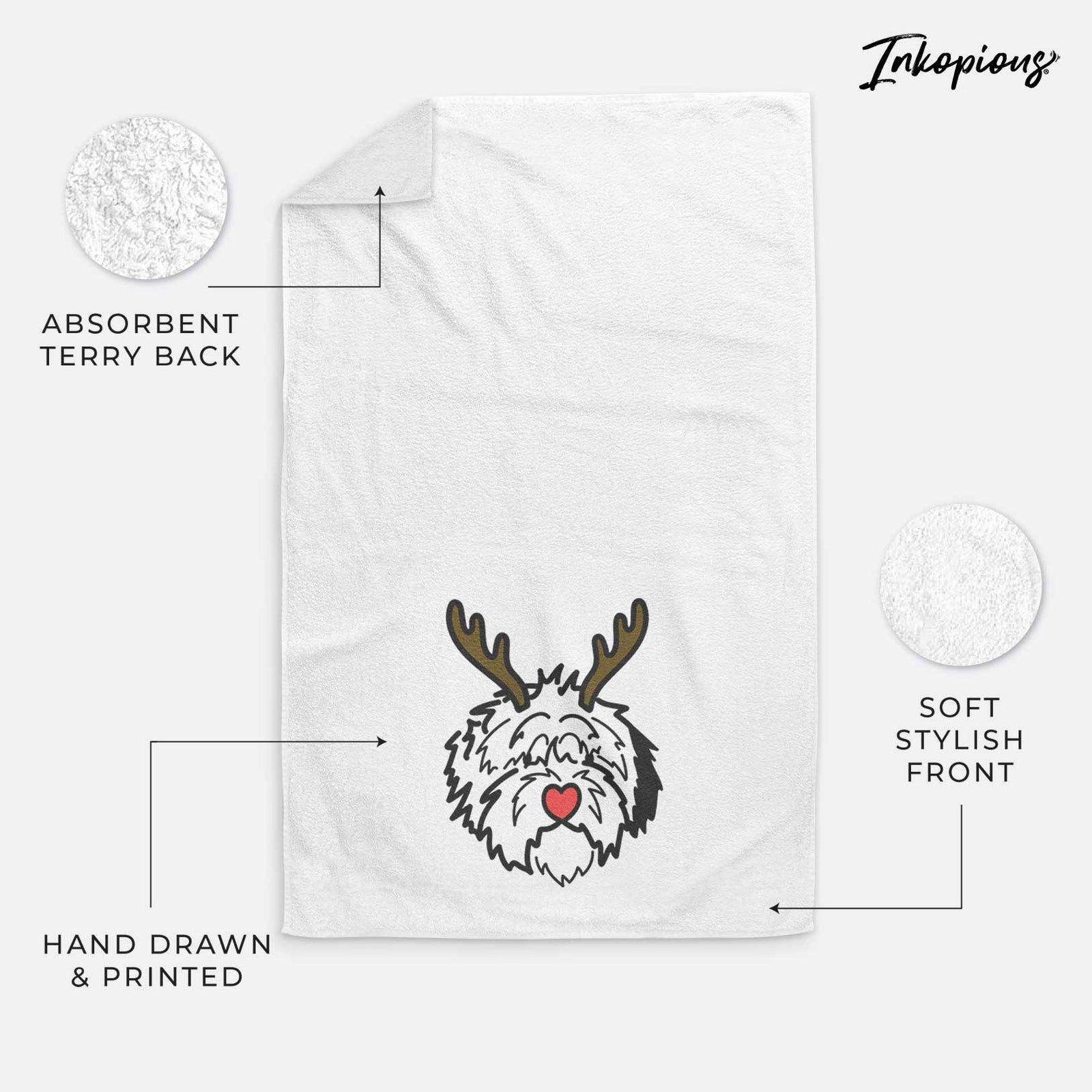 Minimalist line drawing of Penny the Old English Sheepdog with reindeer antlers and a red nose on a decorative hand towel