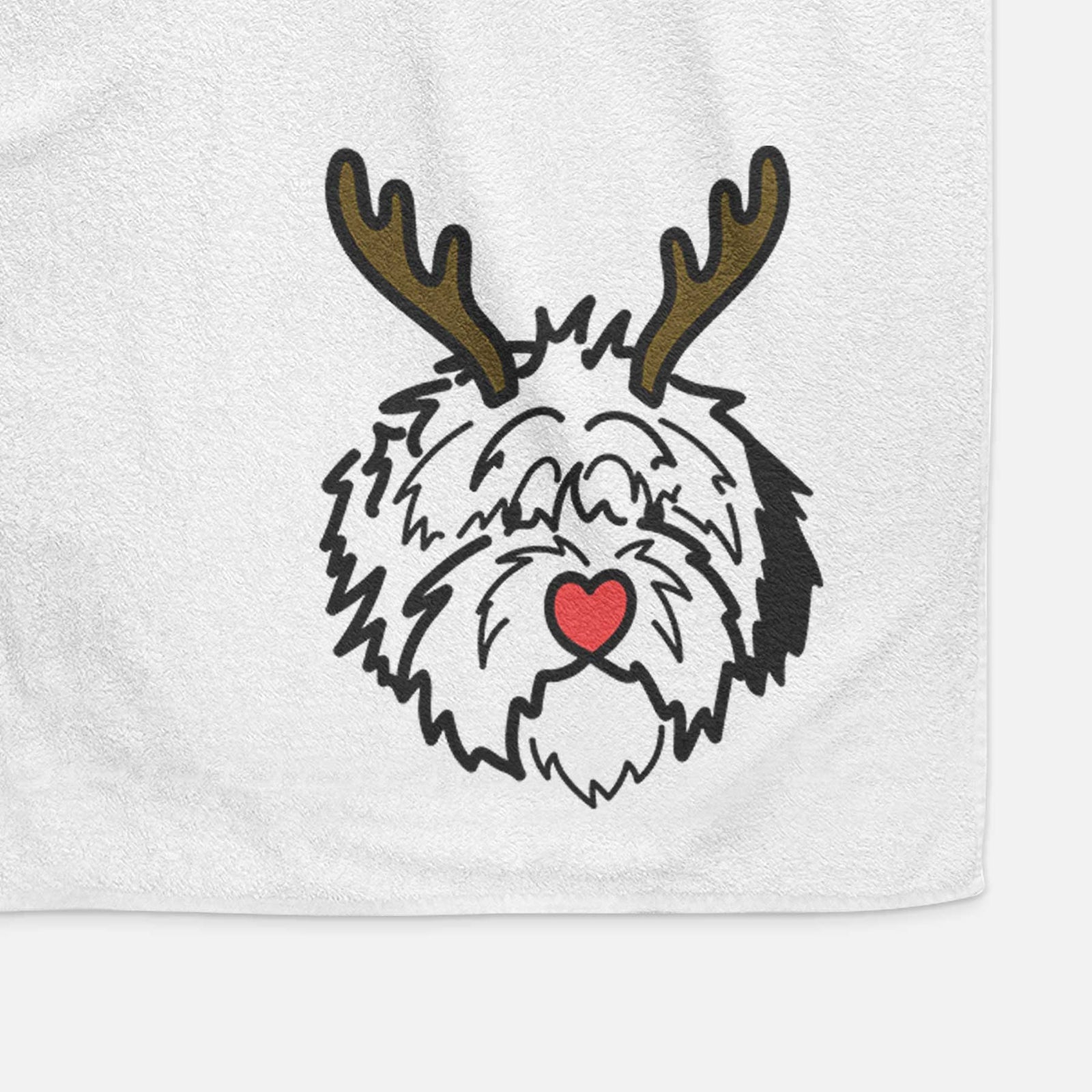 Minimalist line drawing of Penny the Old English Sheepdog with reindeer antlers and a red nose on a decorative hand towel