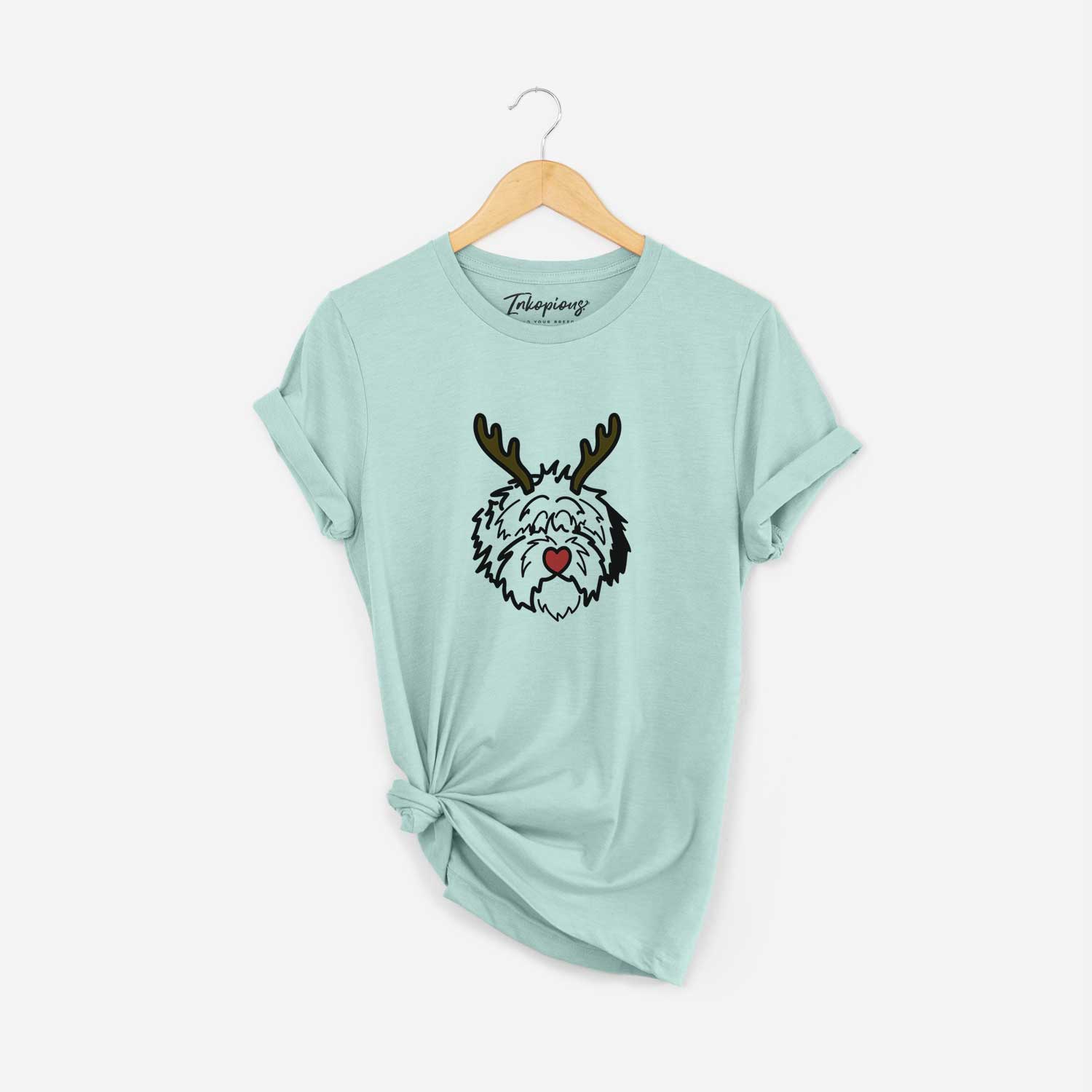 Minimalist line drawing of Penny the Old English Sheepdog with reindeer antlers and a red nose on a Heather Sage Unisex crewneck