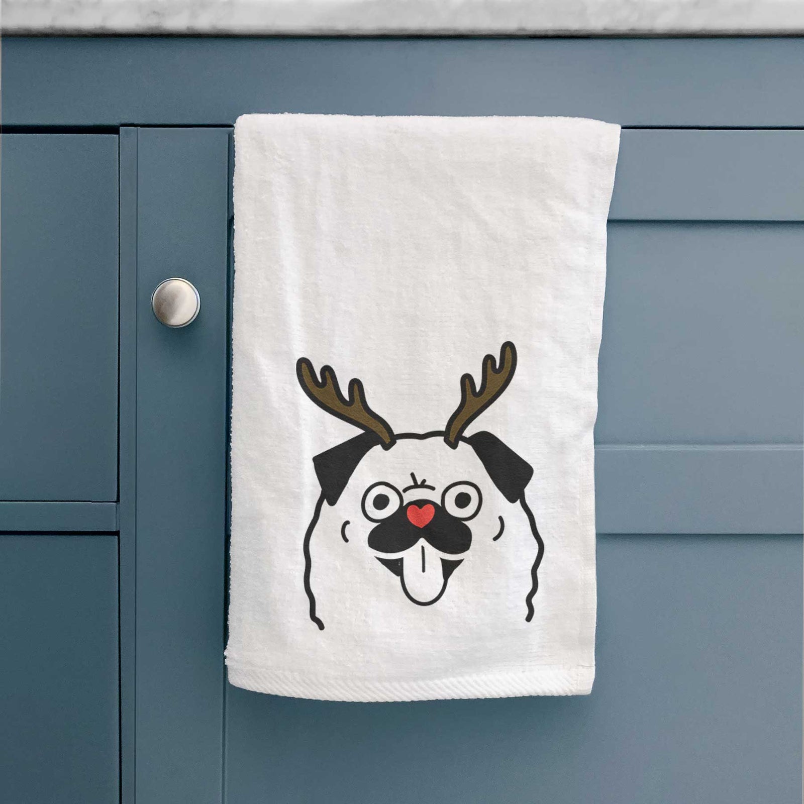 Minimalist line drawing of a Pug with reindeer antlers and a red nose on a decorative hand towel