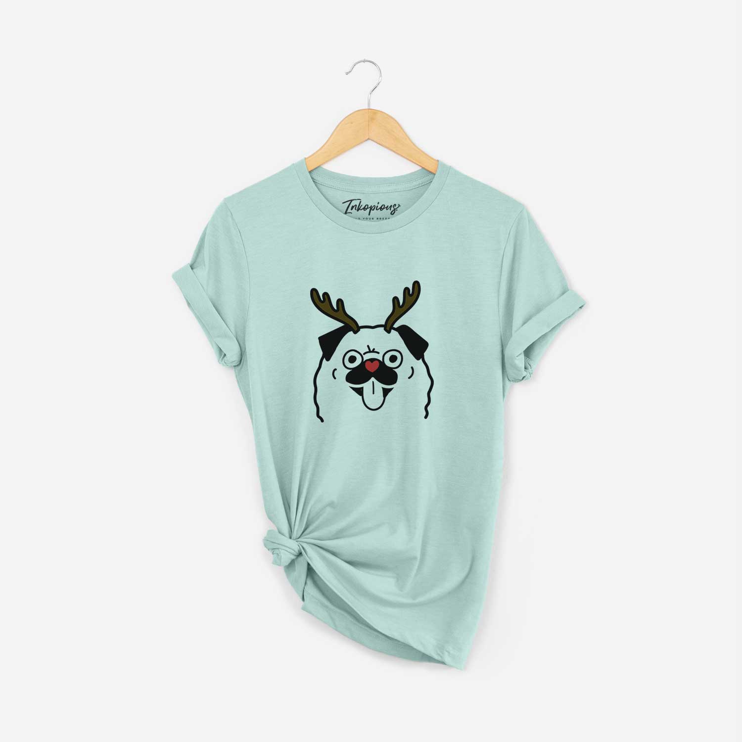 Minimalist line drawing of a Pug with reindeer antlers and a red nose on a Heather Sage Unisex crewneck