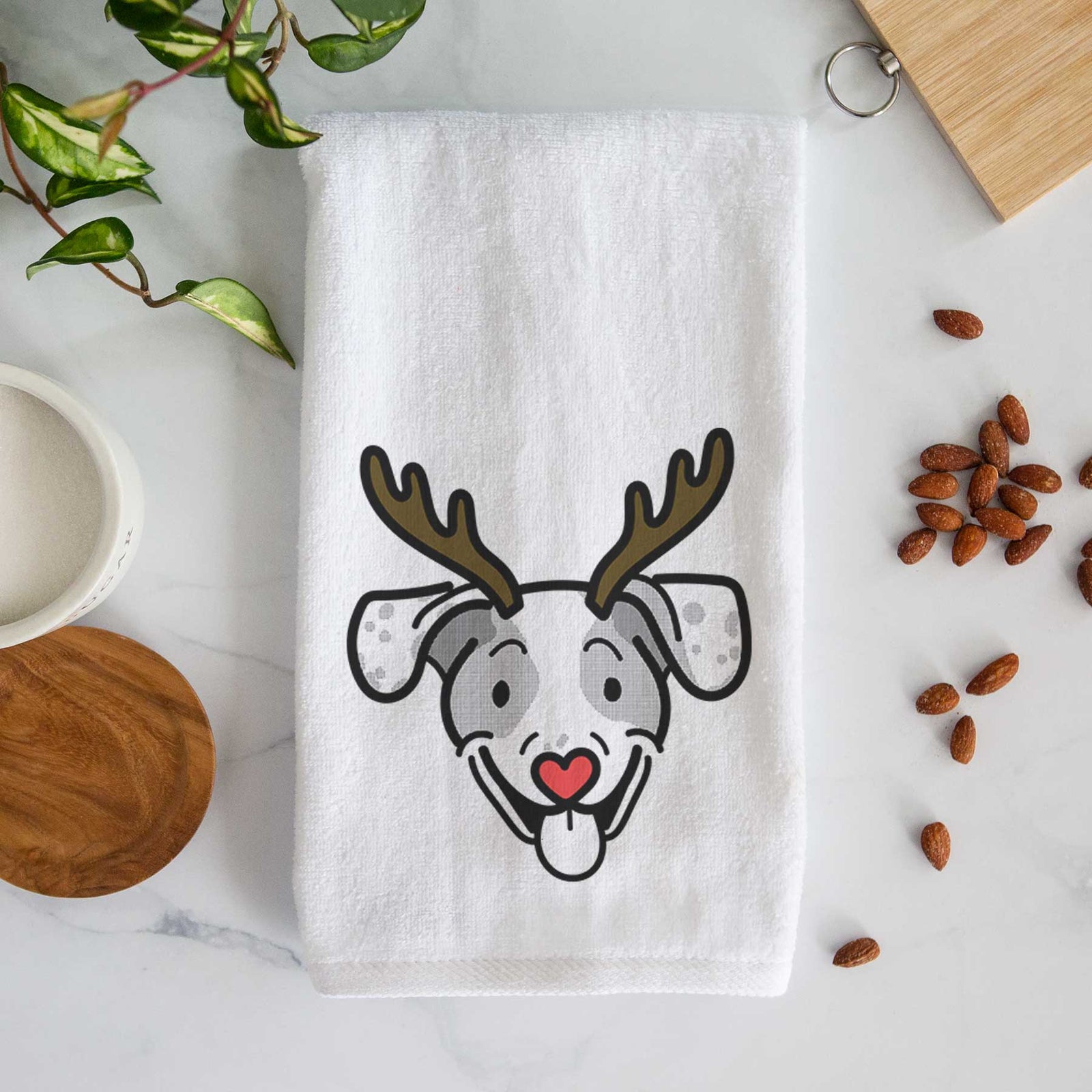 Minimalist line drawing of Roland the Beagle Mix with reindeer antlers and a red nose on a decorative hand towel
