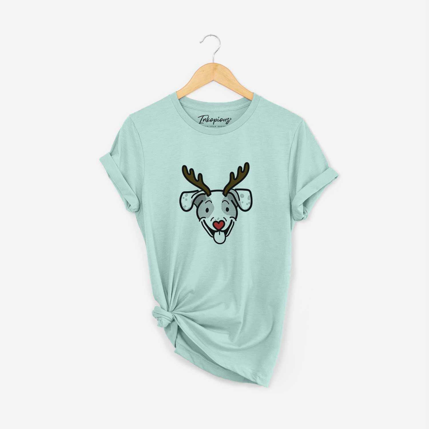 Minimalist line drawing of Roland the Beagle Mix with reindeer antlers and a red nose on a Heather Sage Unisex crewneck