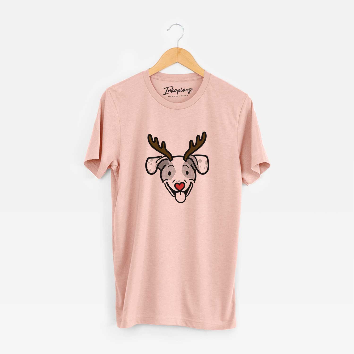 Minimalist line drawing of Roland the Beagle Mix with reindeer antlers and a red nose on a Peach Unisex crewneck
