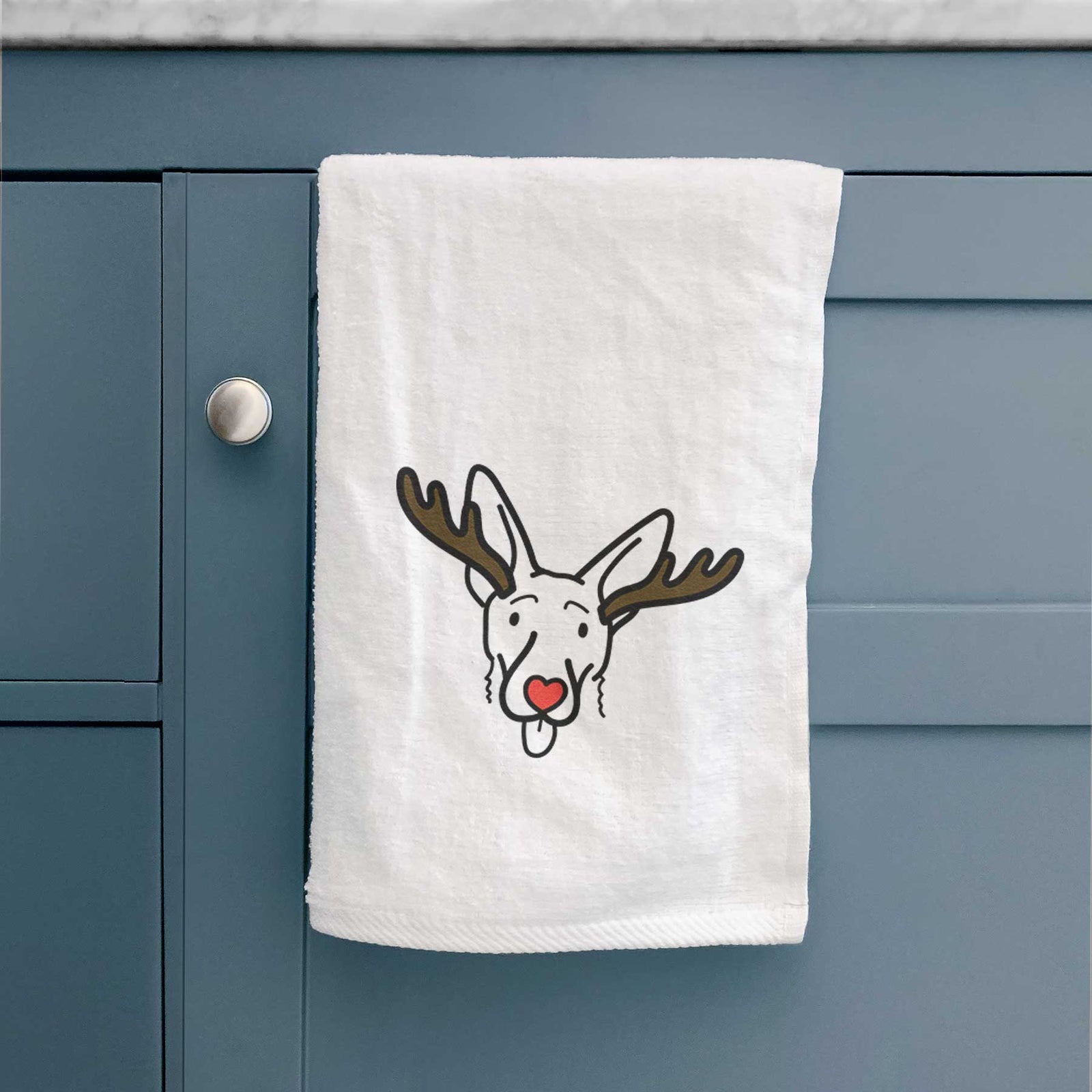 Minimalist line drawing of Rosie the Shepherd Mix with reindeer antlers and a red nose on a decorative hand towel