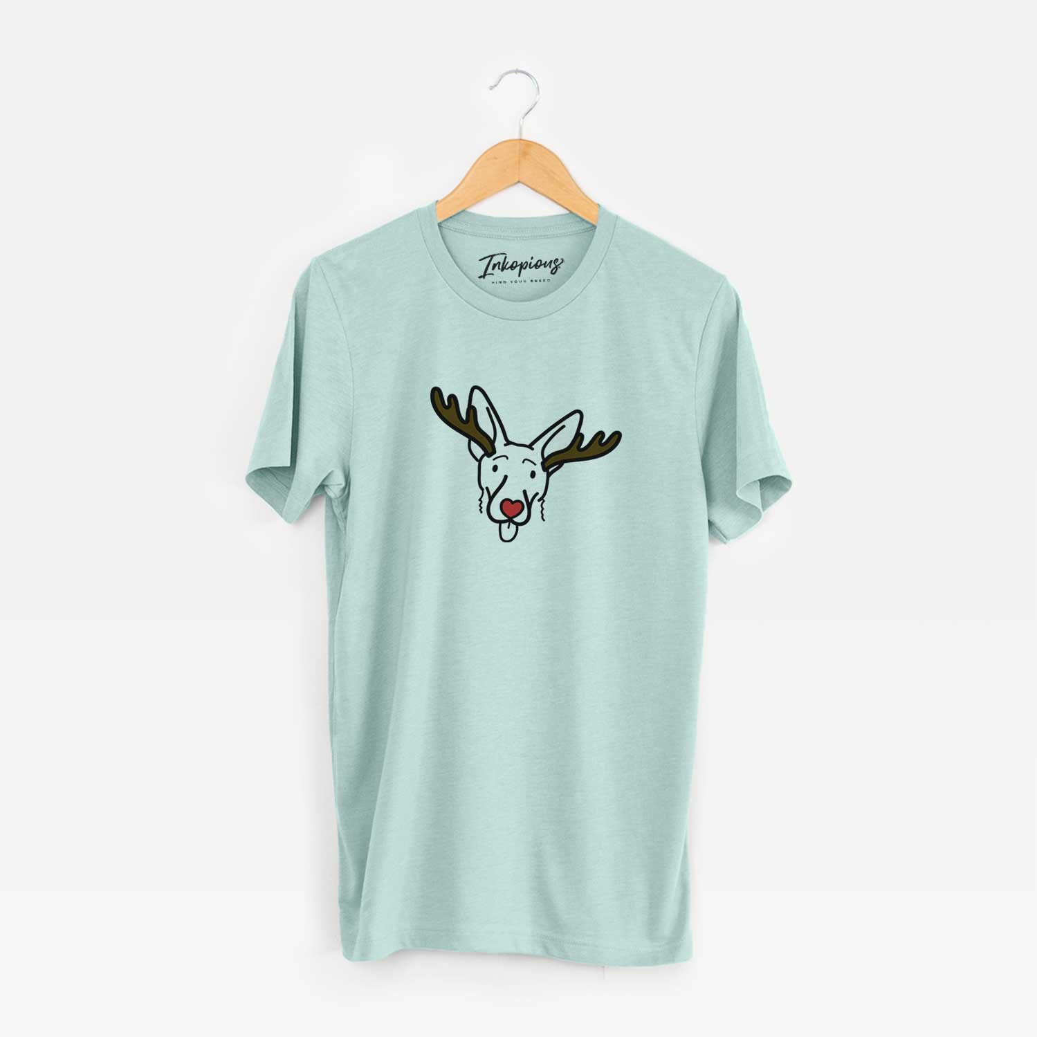 Minimalist line drawing of Rosie the Shepherd Mix with reindeer antlers and a red nose on a Heather Sage Unisex crewneck