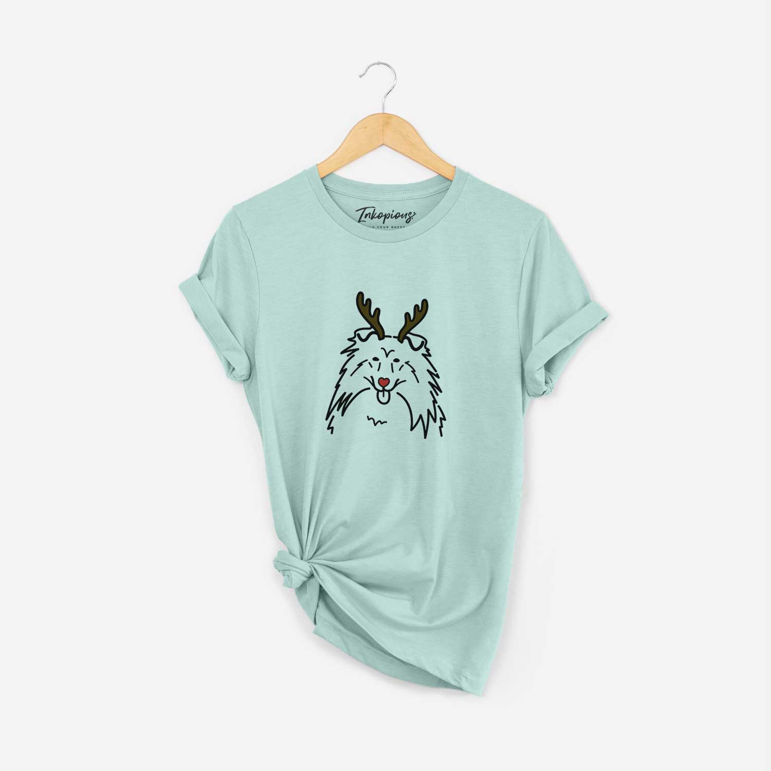 Minimalist line drawing of a Rough Collie with reindeer antlers and a red nose on a Heather Sage Unisex crewneck