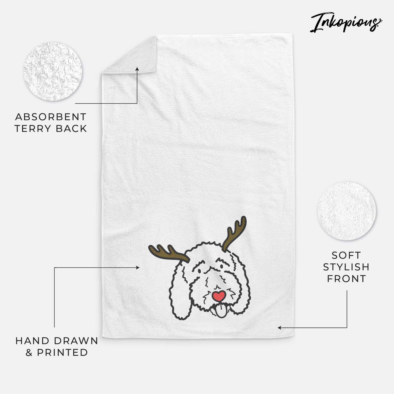 Minimalist line drawing of Ruby the Bernedoodle with reindeer antlers and a red nose on a decorative hand towel