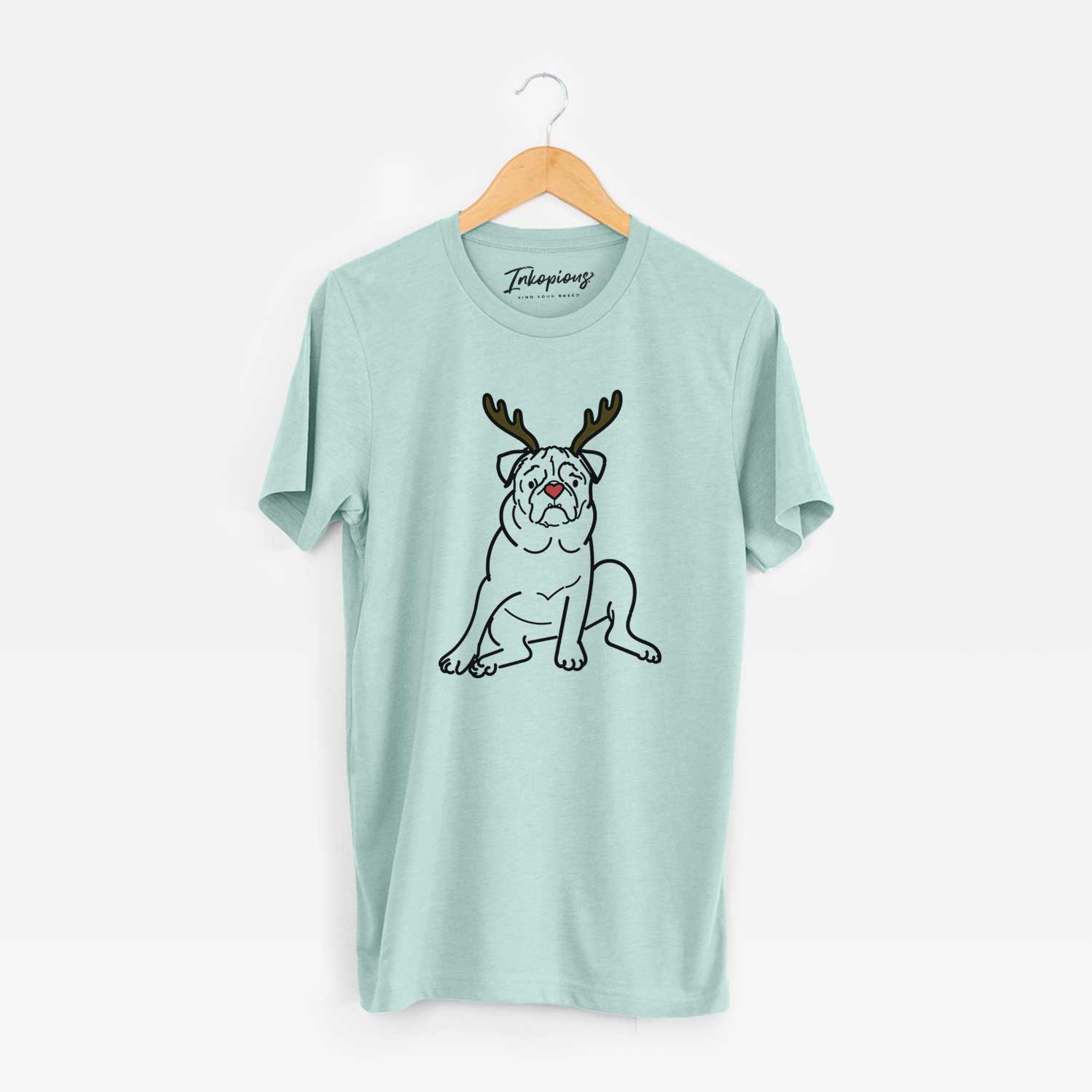 Minimalist line drawing of Rudy the Pug with reindeer antlers and a red nose on a Heather Sage Unisex crewneck