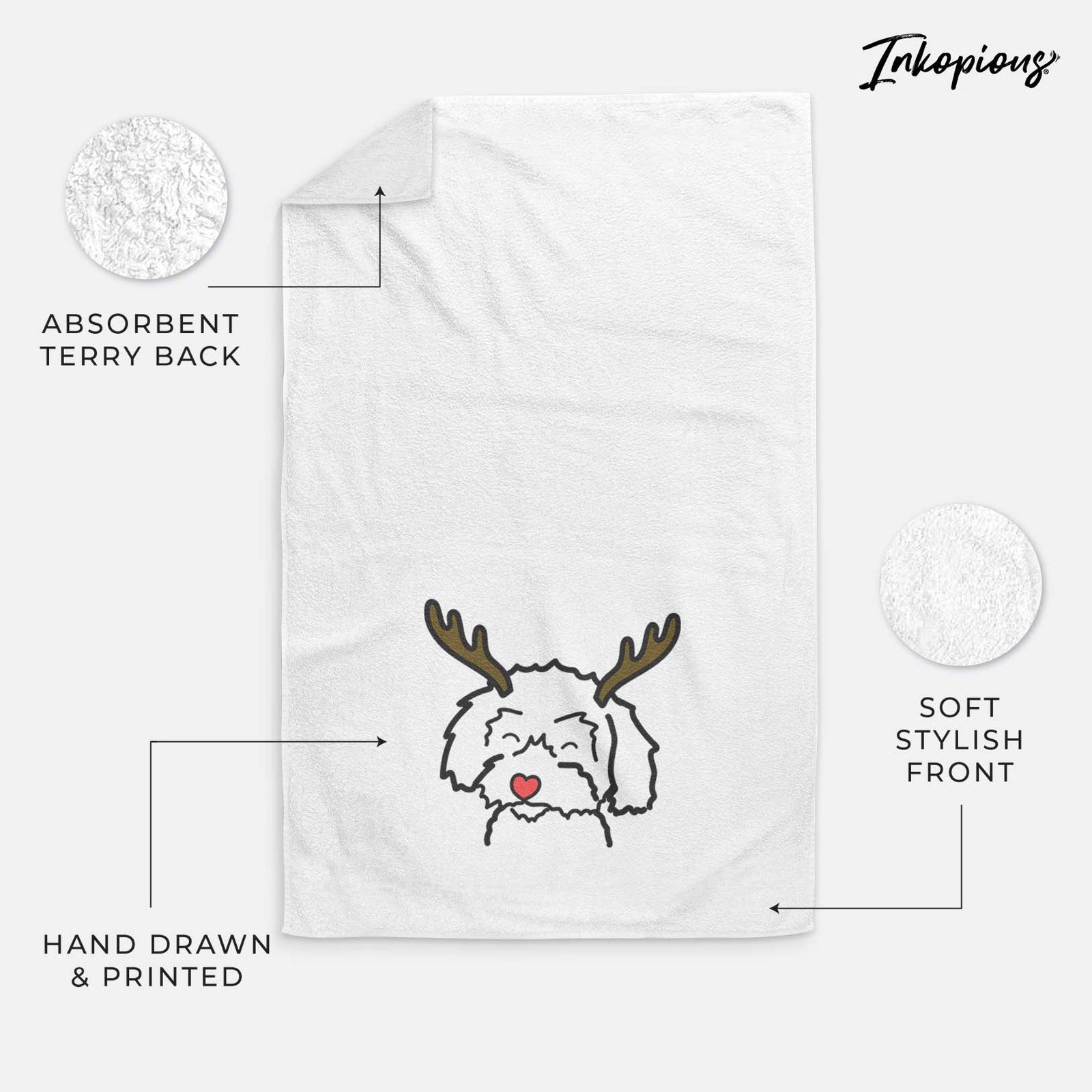 Minimalist line drawing of a Schnoodle with reindeer antlers and a red nose on a decorative hand towel