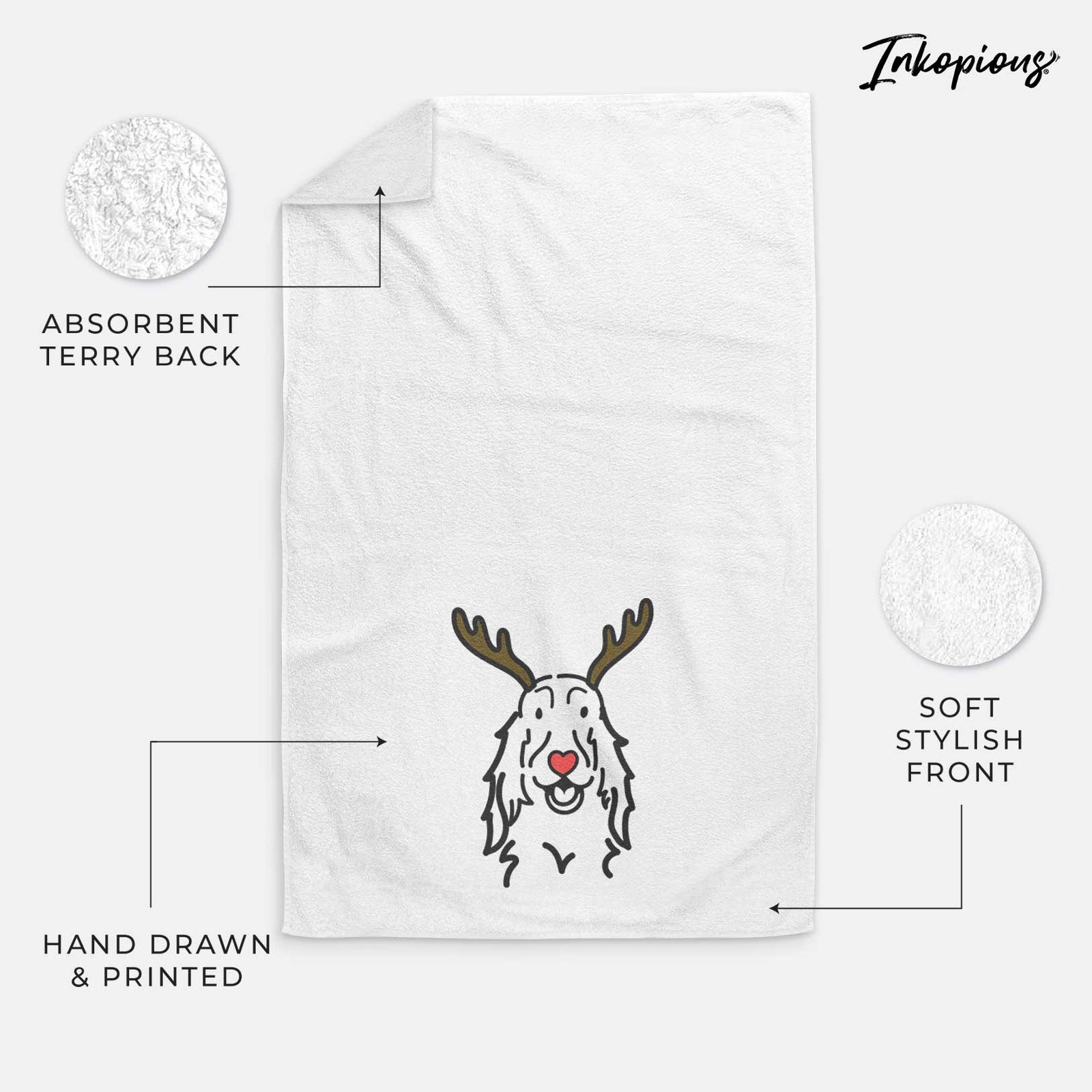 Minimalist line drawing of a Setter with reindeer antlers and a red nose on a decorative hand towel