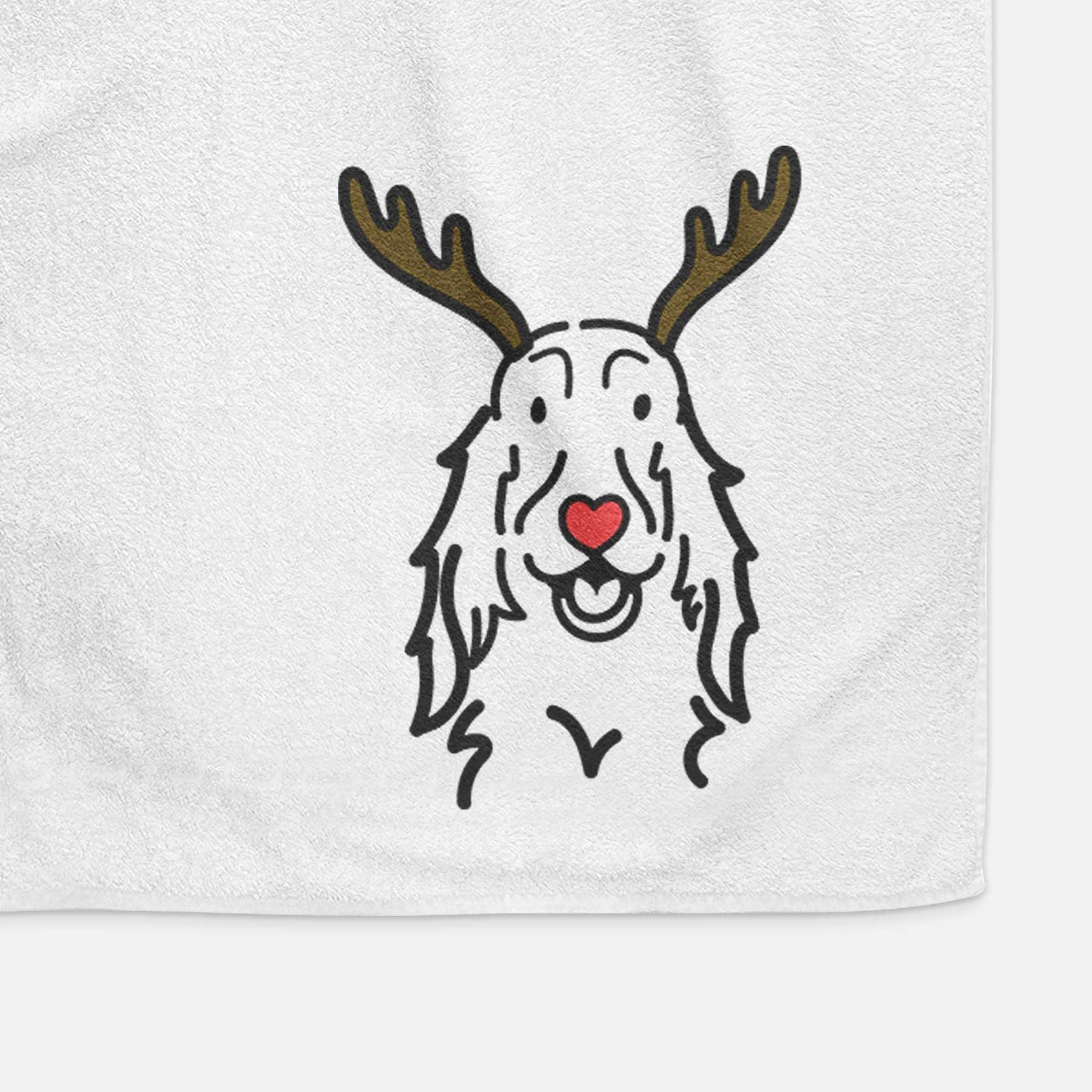 Minimalist line drawing of a Setter with reindeer antlers and a red nose on a decorative hand towel