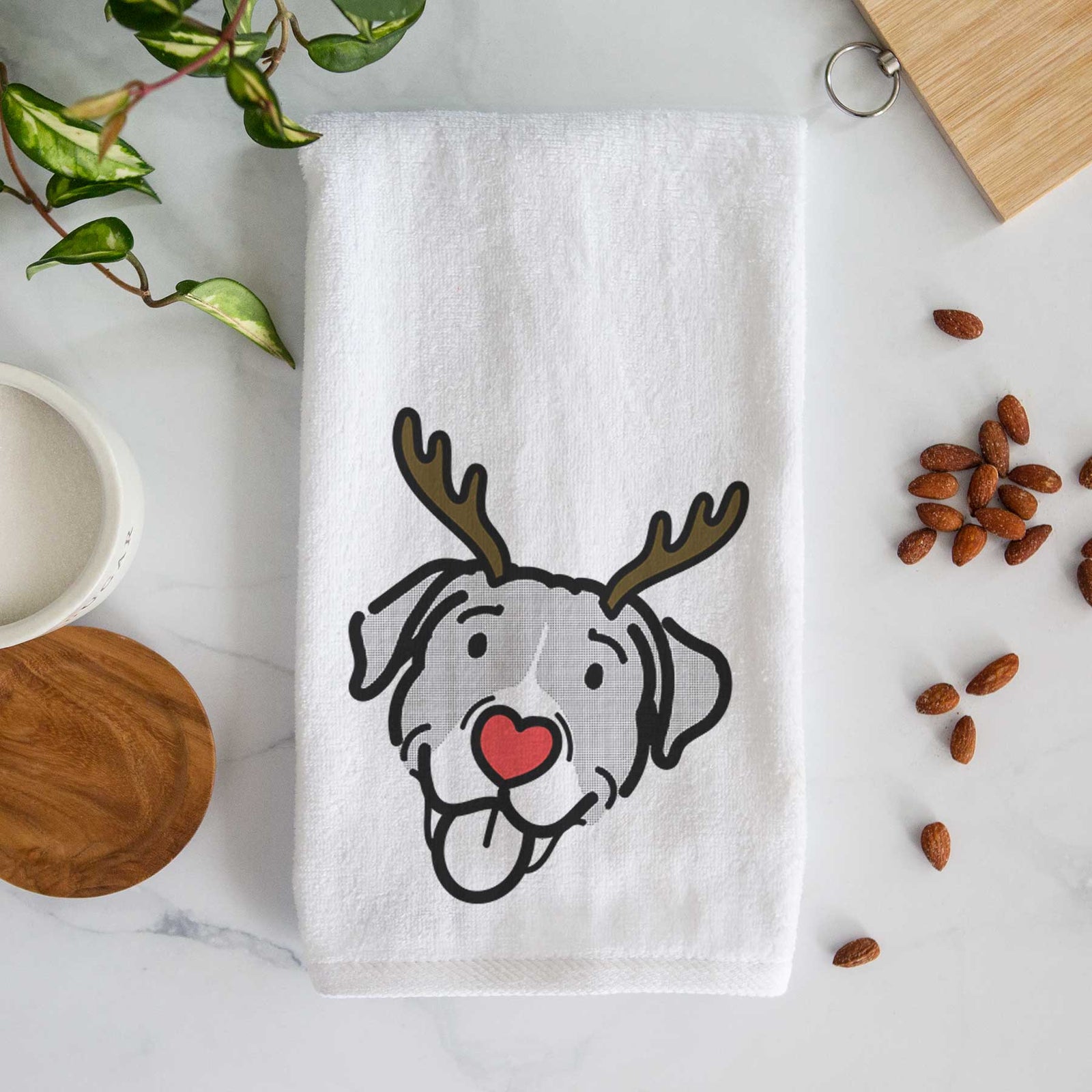 Minimalist line drawing of Shadow the Pitbull Mix with reindeer antlers and a red nose on a decorative hand towel