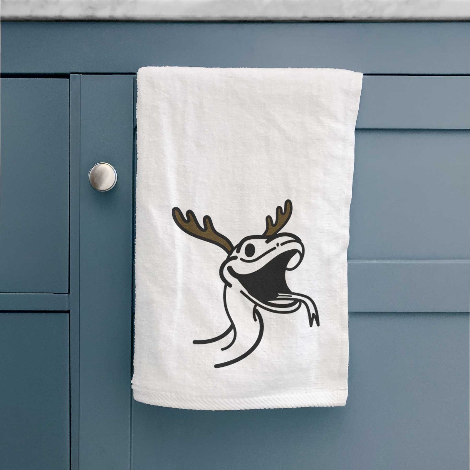 Minimalist line drawing of Spike the Snake with reindeer antlers and a red nose on a decorative hand towel