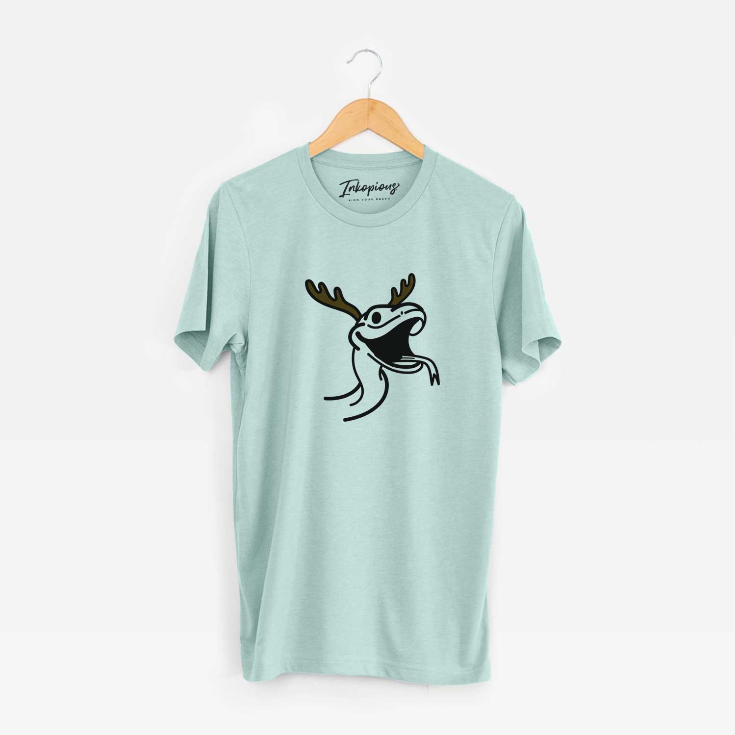 Minimalist line drawing of Spike the Snake with reindeer antlers and a red nose on a Heather Sage Unisex crewneck