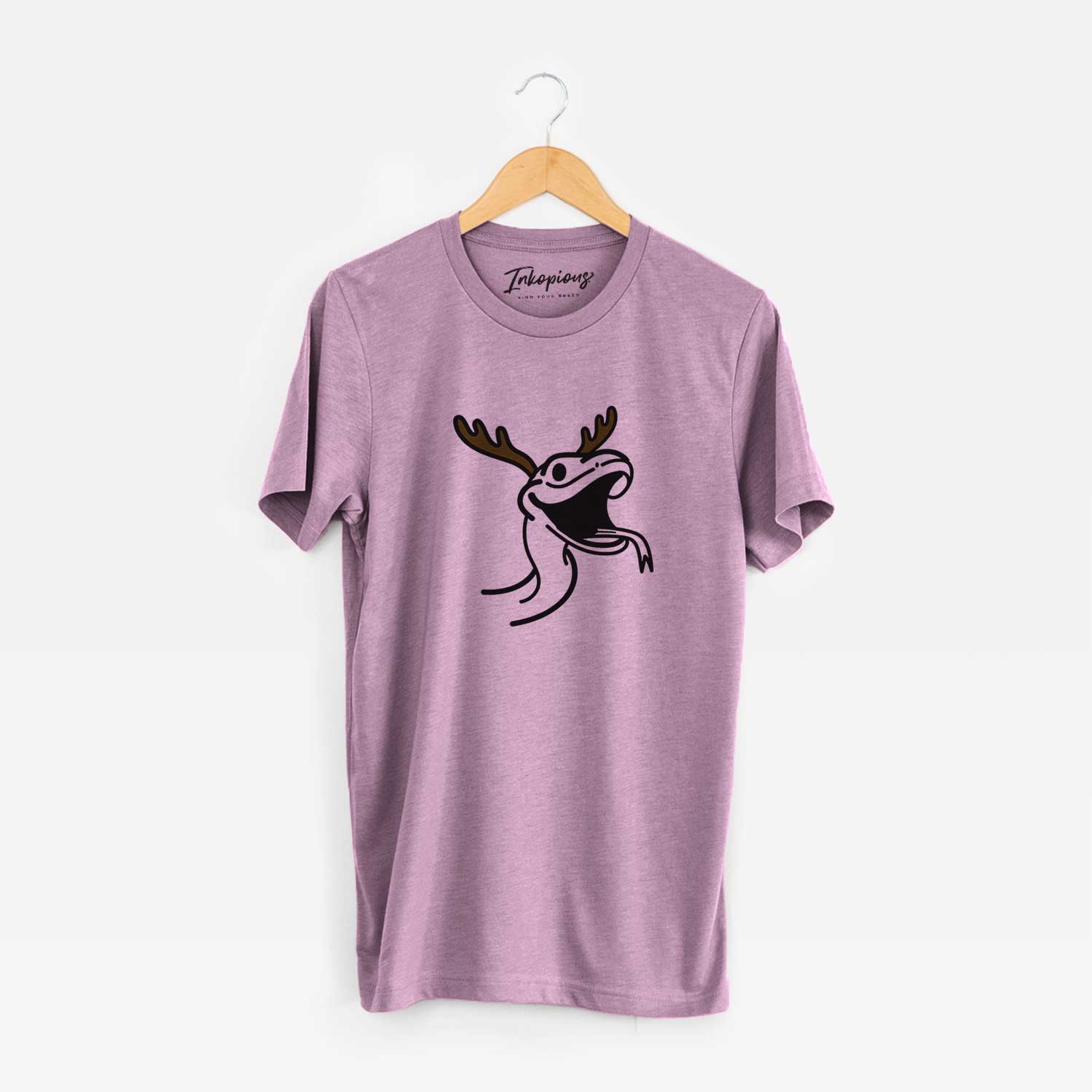 Minimalist line drawing of Spike the Snake with reindeer antlers and a red nose on an Orchid Unisex crewneck