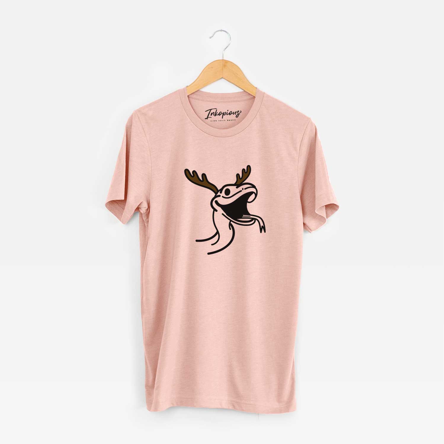 Minimalist line drawing of Spike the Snake with reindeer antlers and a red nose on a Peach Unisex crewneck