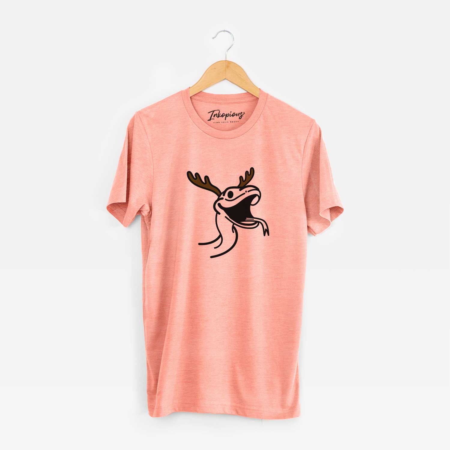 Minimalist line drawing of Spike the Snake with reindeer antlers and a red nose on a Sunset Unisex crewneck