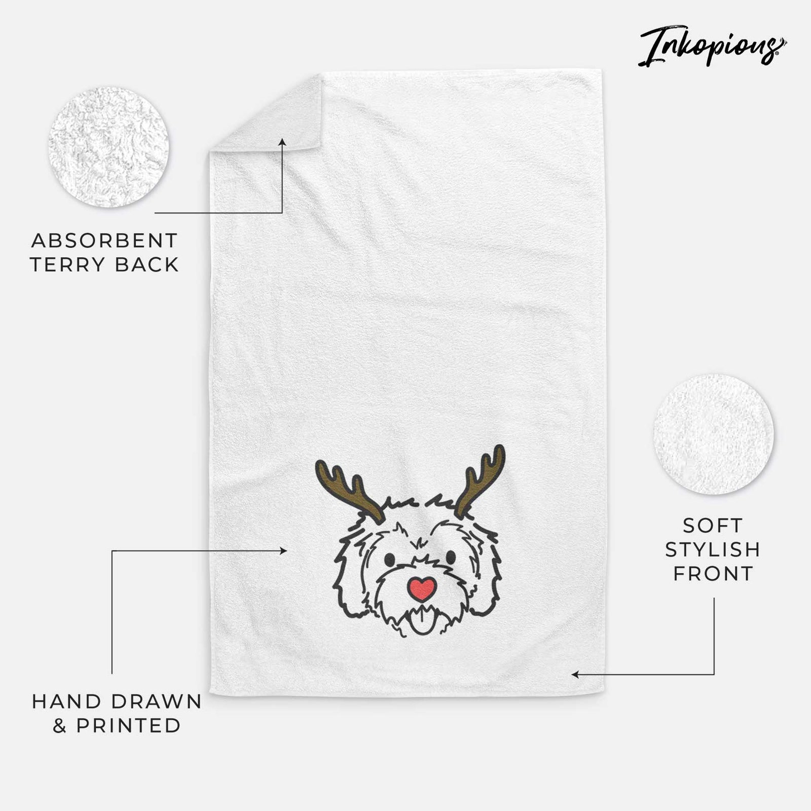 Minimalist line drawing of Sprinkles the Cockapoo with reindeer antlers and a red nose on a decorative hand towel