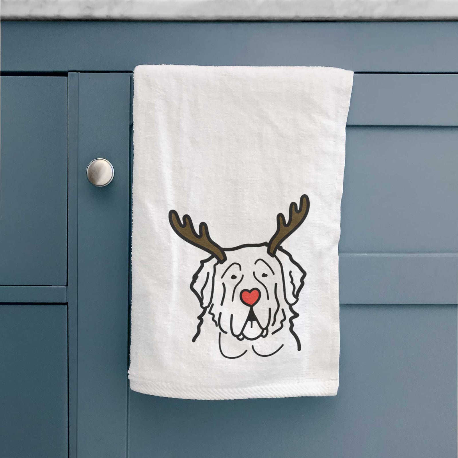 Minimalist line drawing of a Saint Bernard with reindeer antlers and a red nose on a decorative hand towel