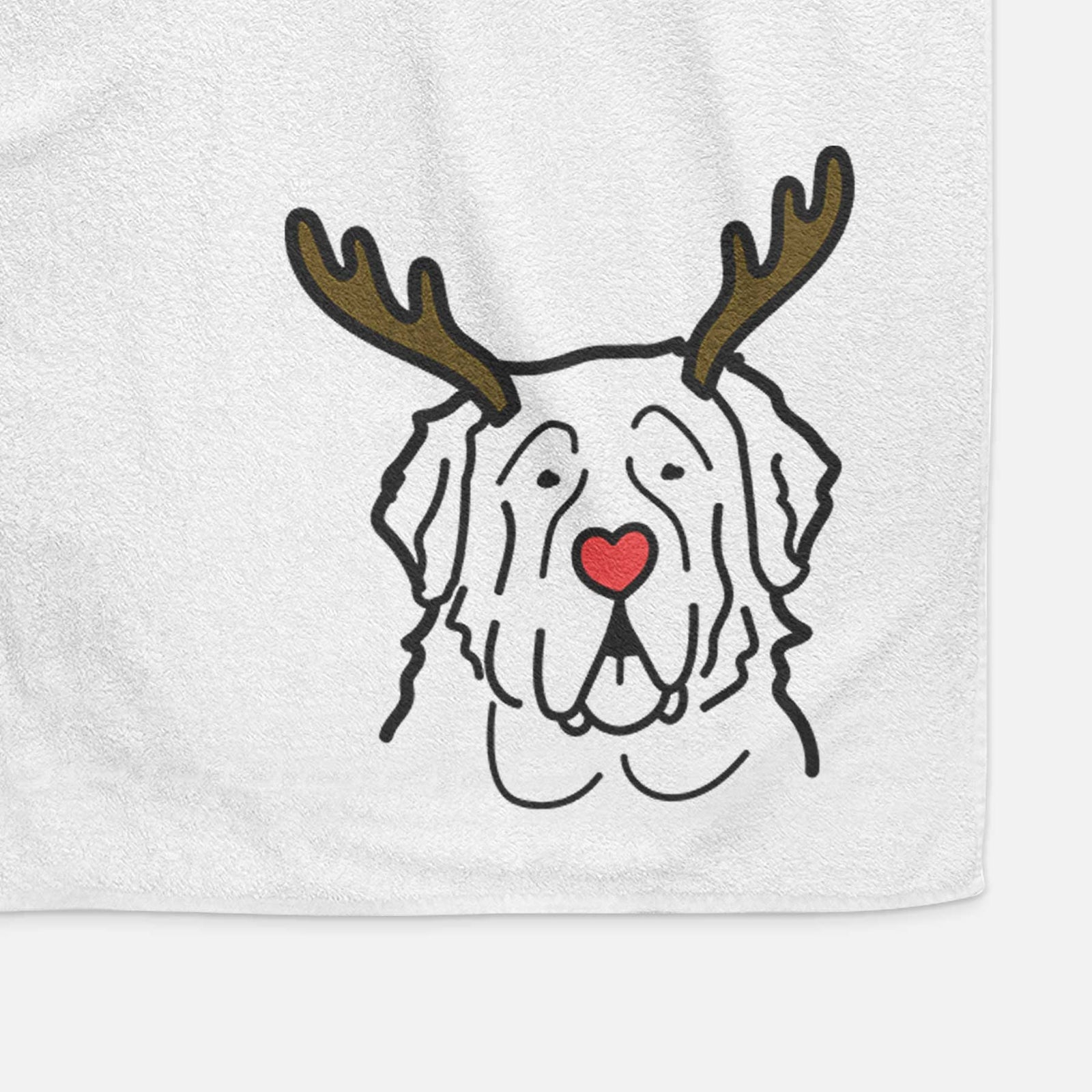 Minimalist line drawing of a Saint Bernard with reindeer antlers and a red nose on a decorative hand towel