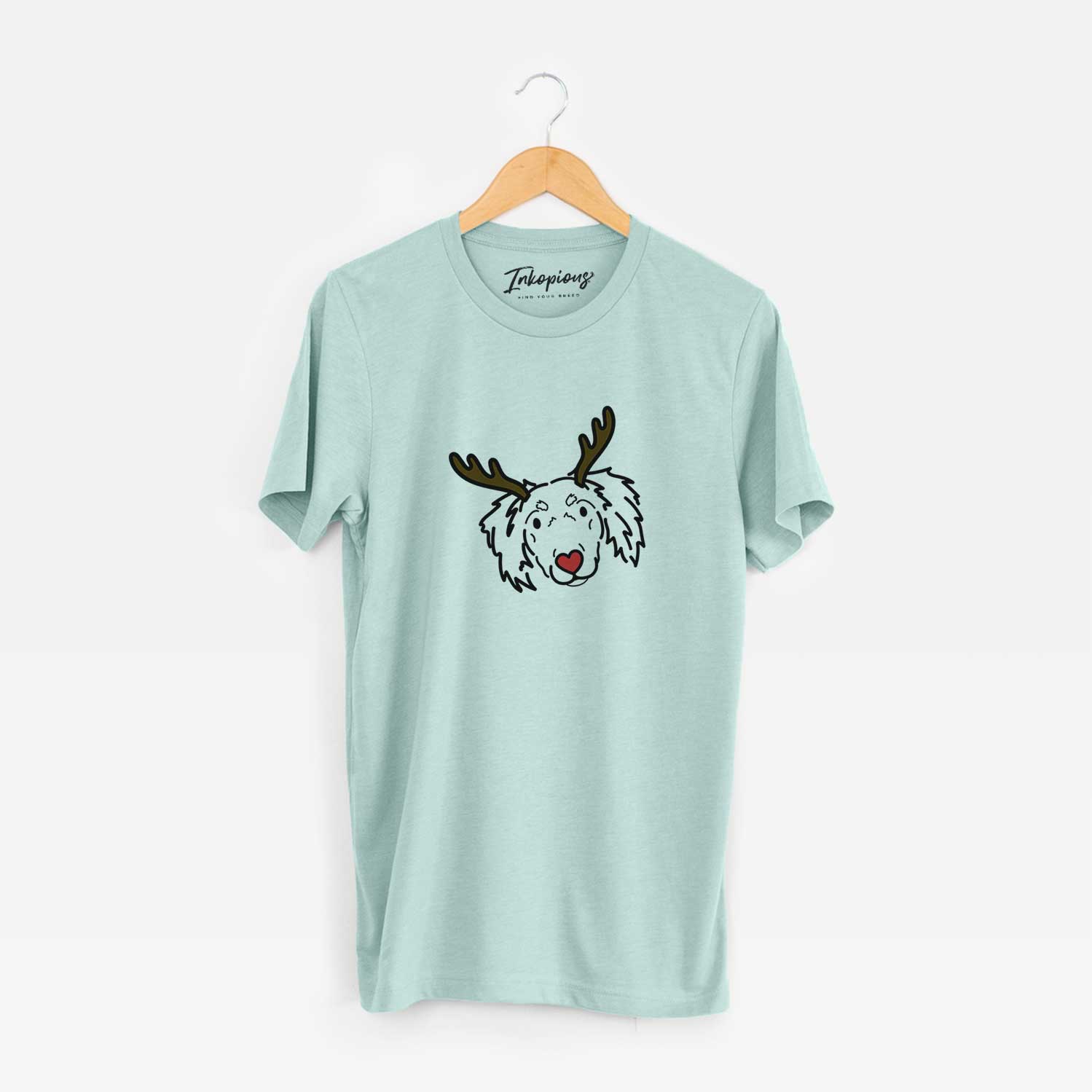 Minimalist line drawing of Tilly the Dachshund Mix with reindeer antlers and a red nose on a Heather Sage Unisex crewneck