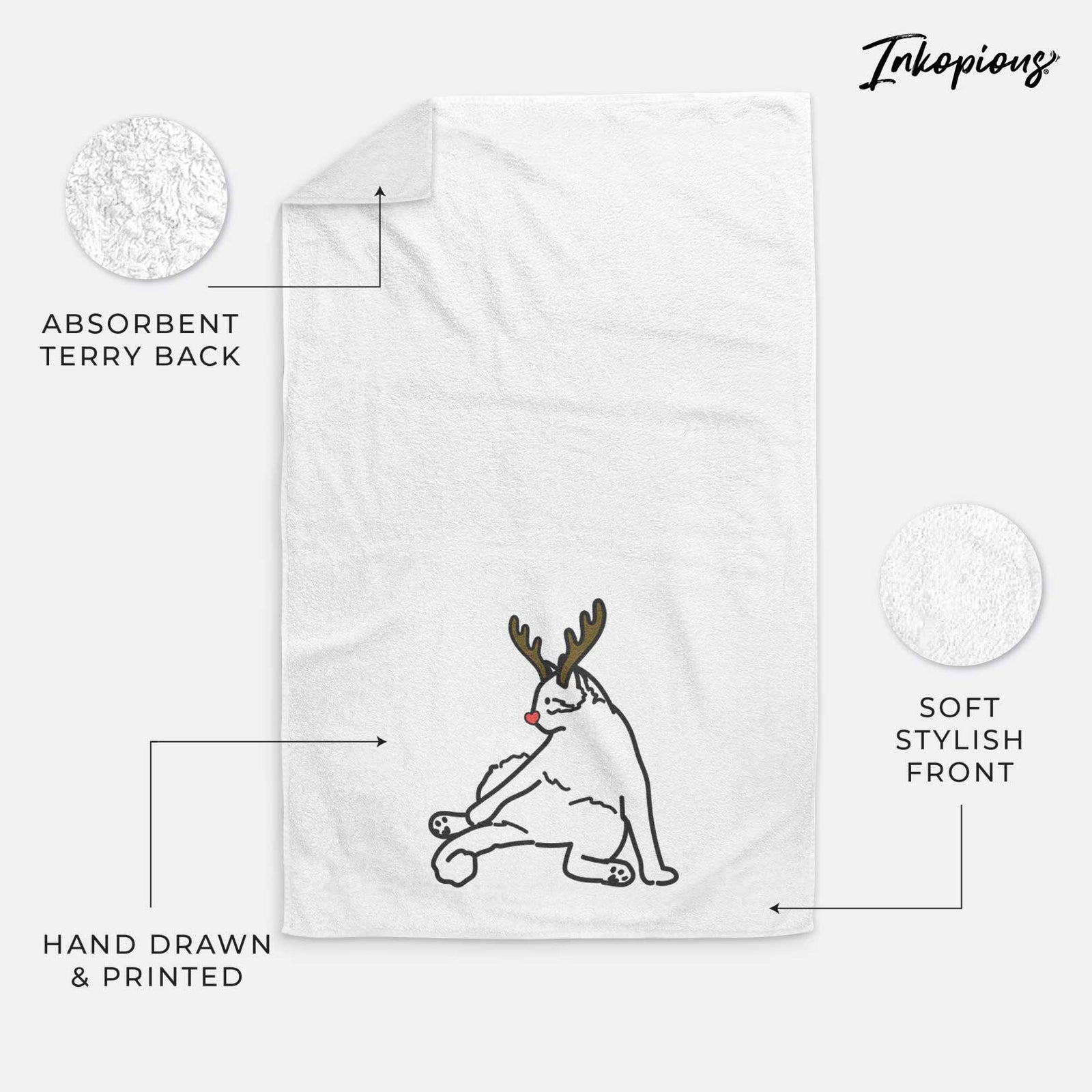 Minimalist line drawing of Tom the Cat with reindeer antlers and a red nose on a decorative hand towel