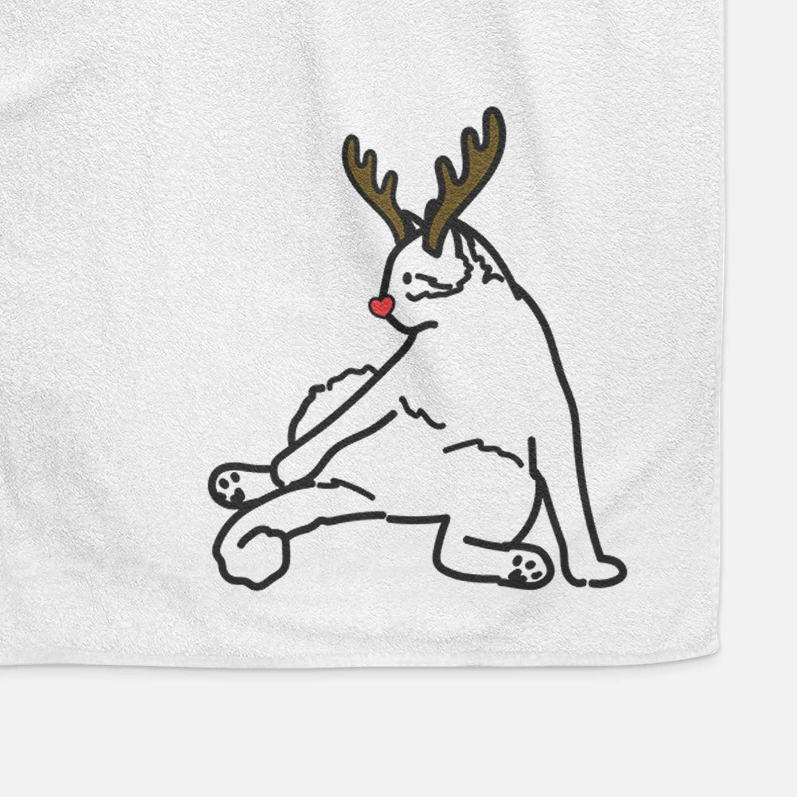 Minimalist line drawing of Tom the Cat with reindeer antlers and a red nose on a decorative hand towel