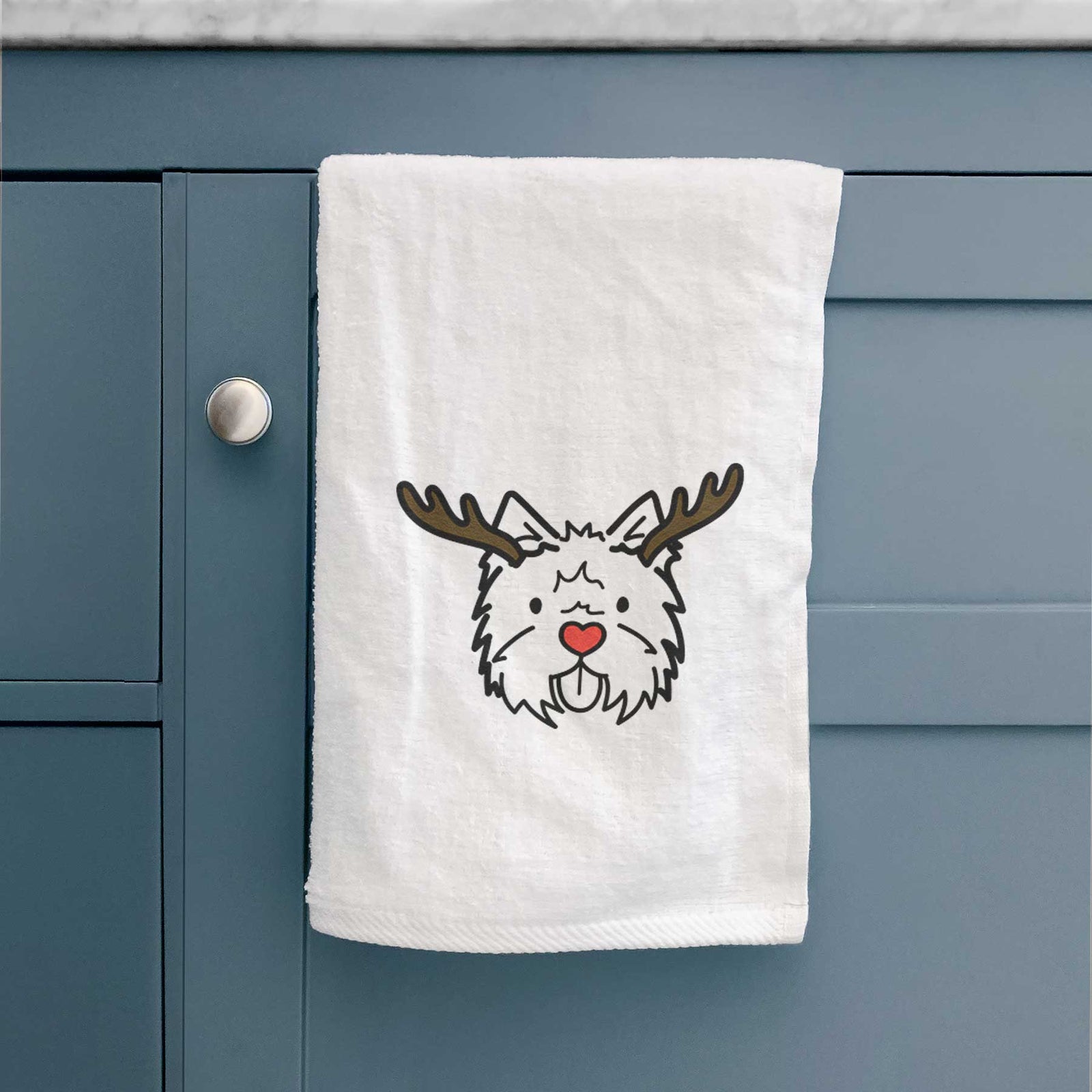 Minimalist line drawing of a West Highland Terrier with reindeer antlers and a red nose on a decorative hand towel