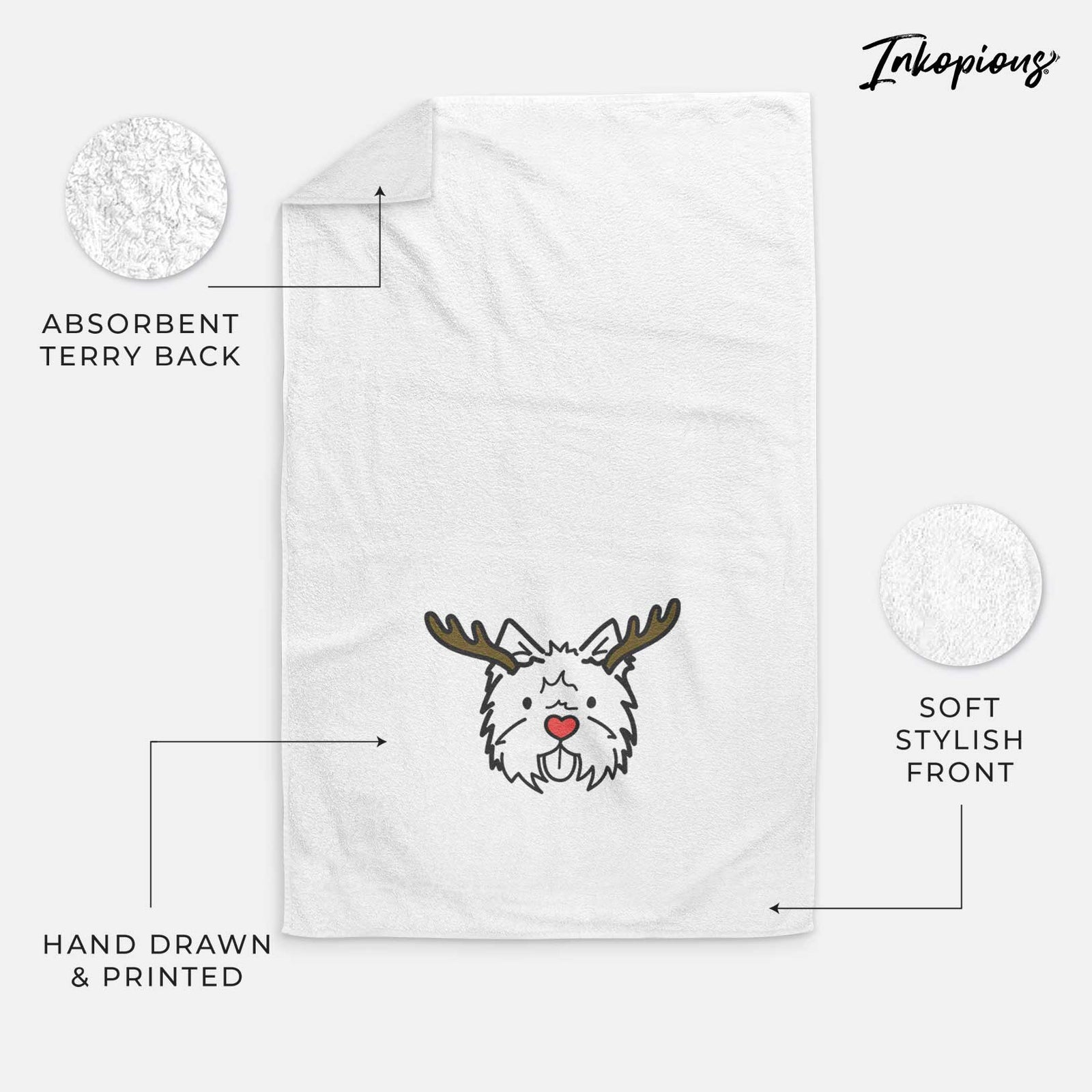Minimalist line drawing of a West Highland Terrier with reindeer antlers and a red nose on a decorative hand towel