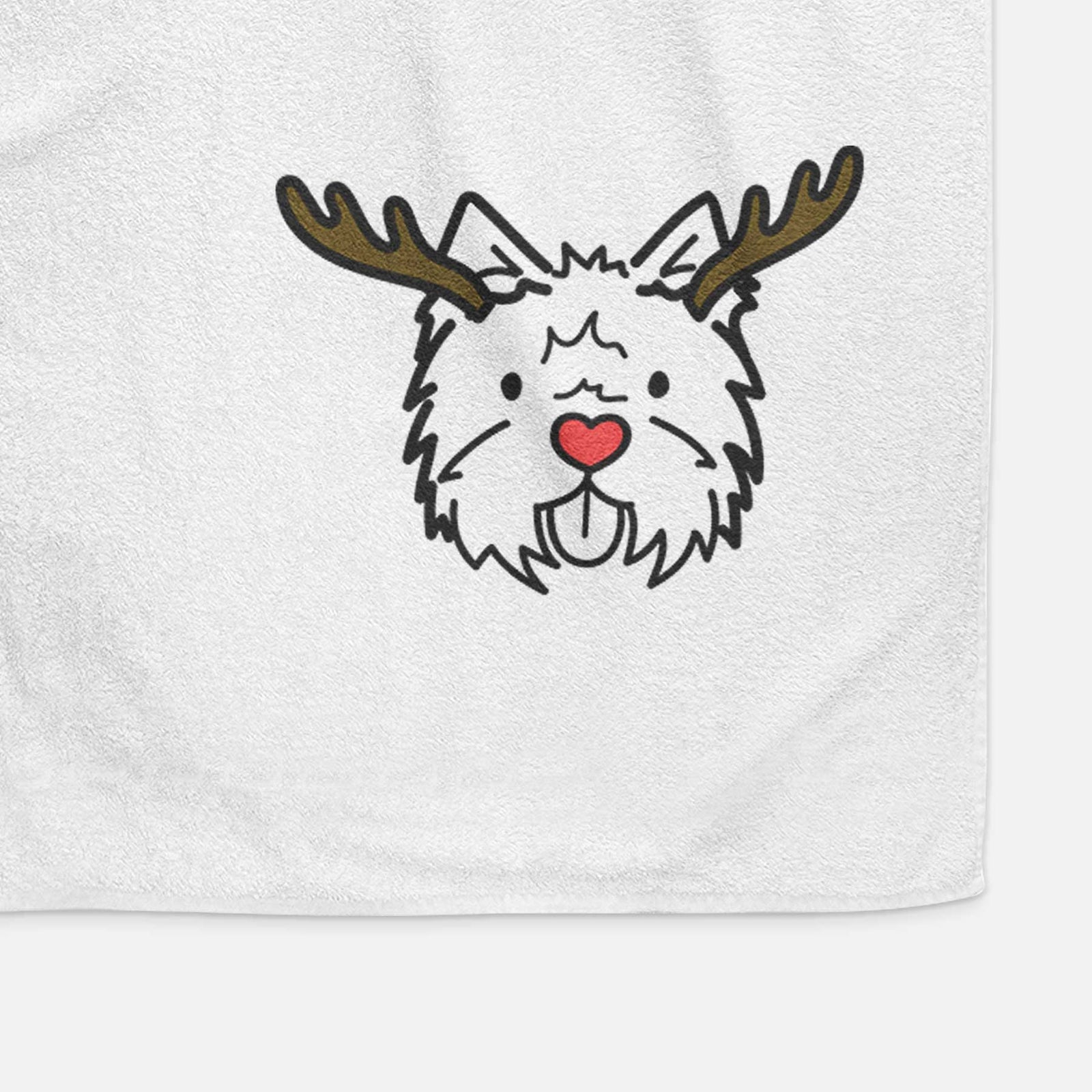 Minimalist line drawing of a West Highland Terrier with reindeer antlers and a red nose on a decorative hand towel