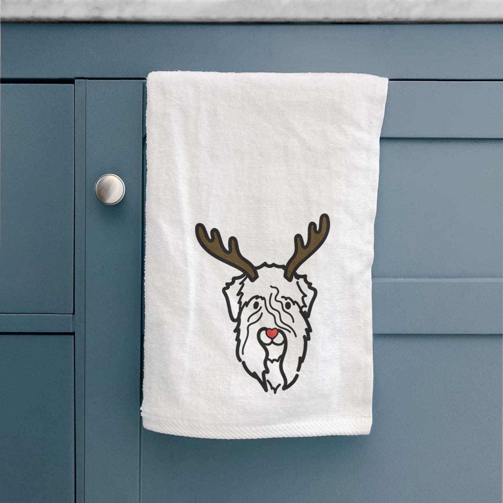 Minimalist line drawing of a Soft Coated Wheaten Terrier with reindeer antlers and a red nose on a decorative hand towel