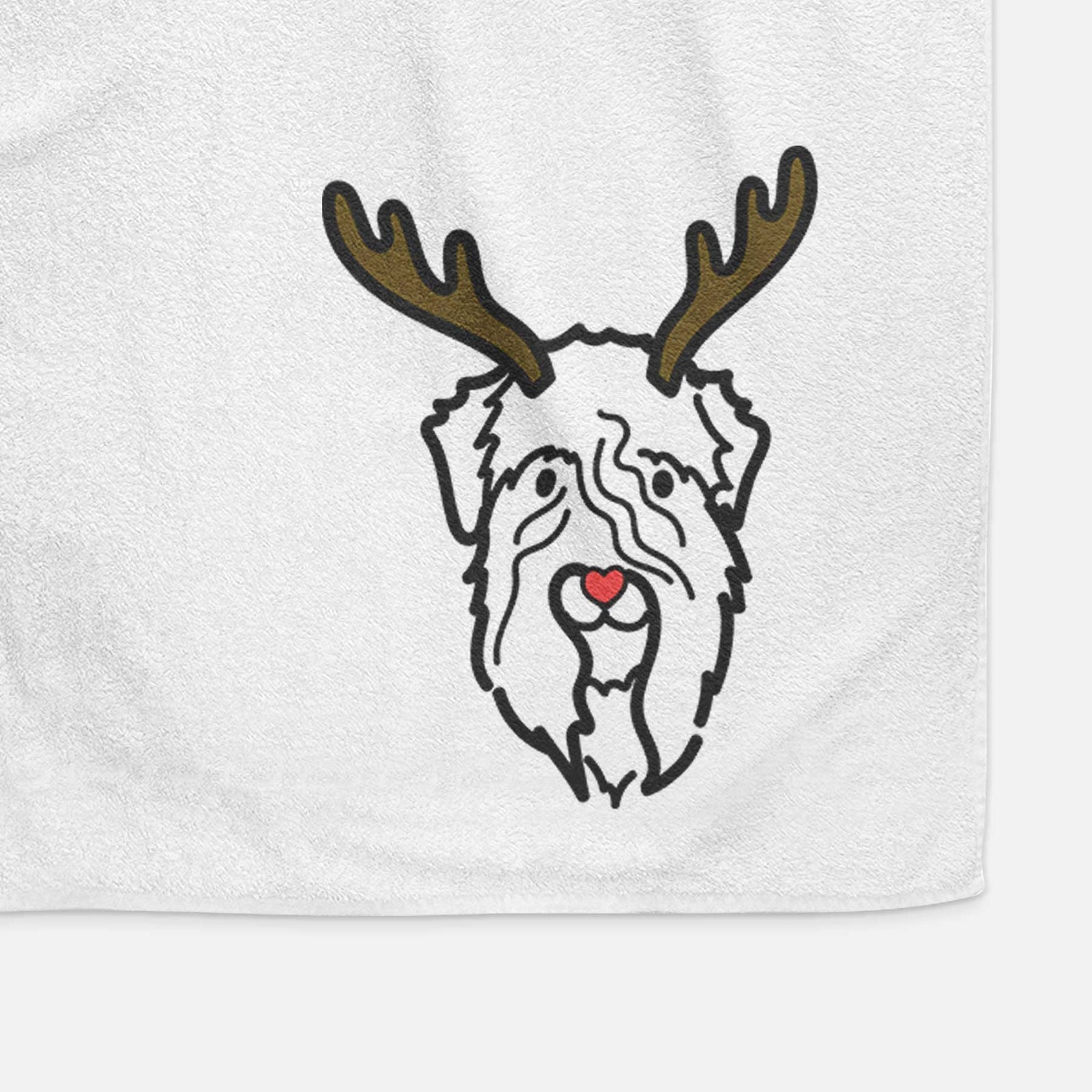 Minimalist line drawing of a Soft Coated Wheaten Terrier with reindeer antlers and a red nose on a decorative hand towel